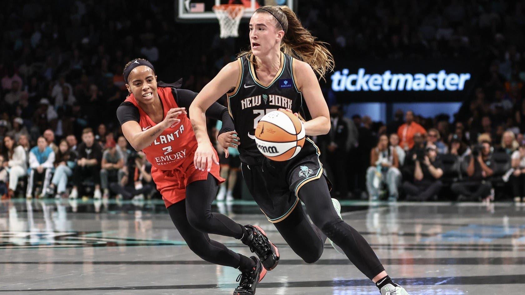 Sep 24, 2024; Brooklyn, New York, USA; New York Liberty guard Sabrina Ionescu (20) drives past Atlanta Dream guard Jordin Canada (3) during game two of the first round of the 2024 WNBA Playoffs at Barclays Center. / Wendell Cruz-Imagn Images