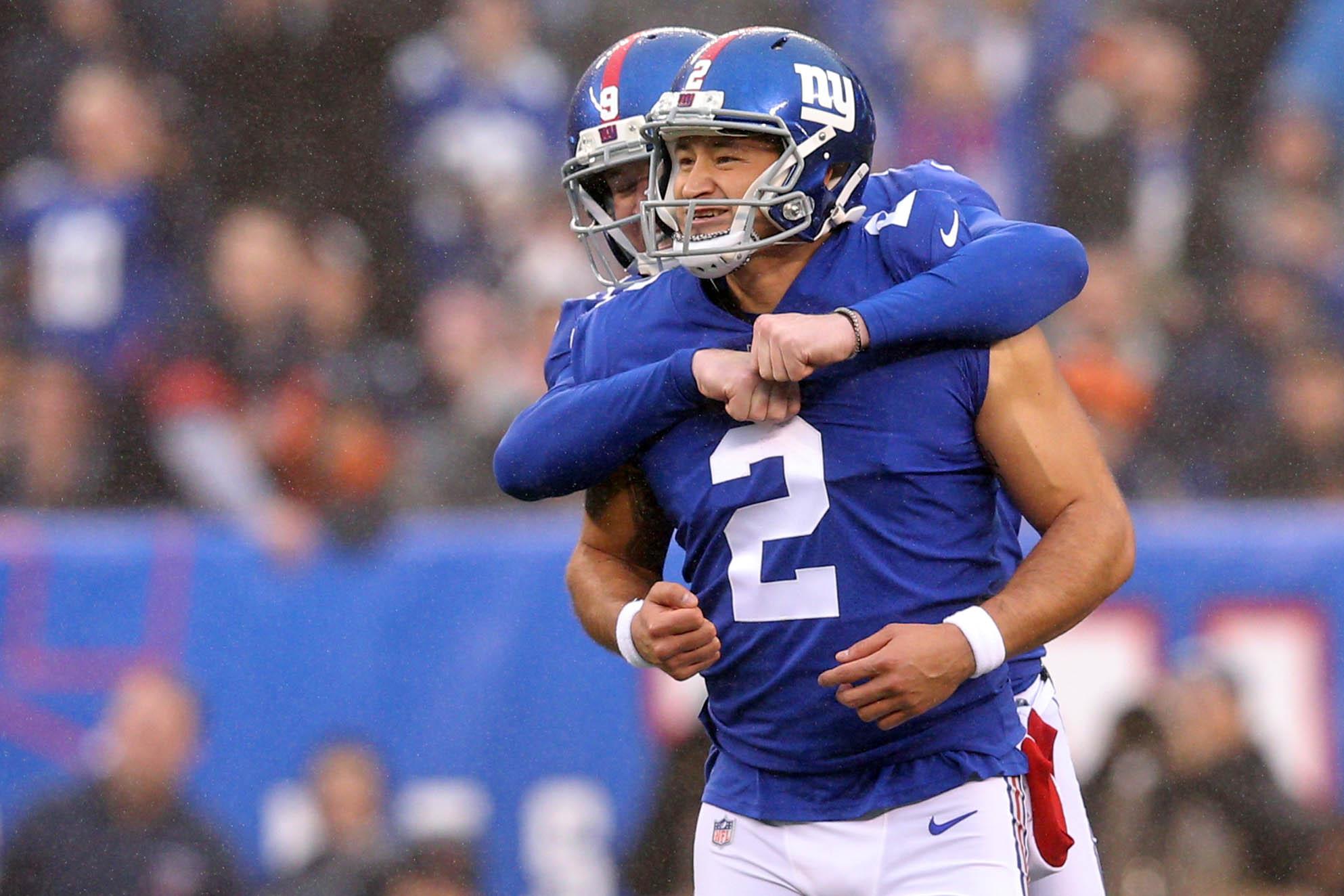 Dec 2, 2018; East Rutherford, NJ, USA; New York Giants kicker Aldrick Rosas (2) celebrates a field goal against the Chicago Bears with New York Giants punter Riley Dixon (9) during the second quarter at MetLife Stadium. Mandatory Credit: Brad Penner-USA TODAY Sports