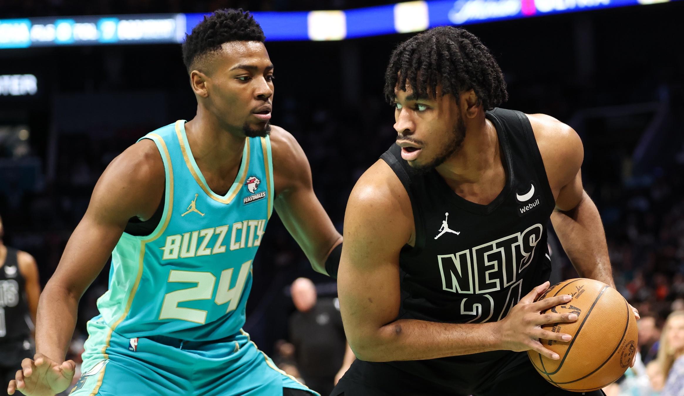 Brooklyn Nets guard Cam Thomas (24) works the play around Charlotte Hornets forward Brandon Miller (24) during the first quarter at Spectrum Center. / Cory Knowlton-USA TODAY Sports