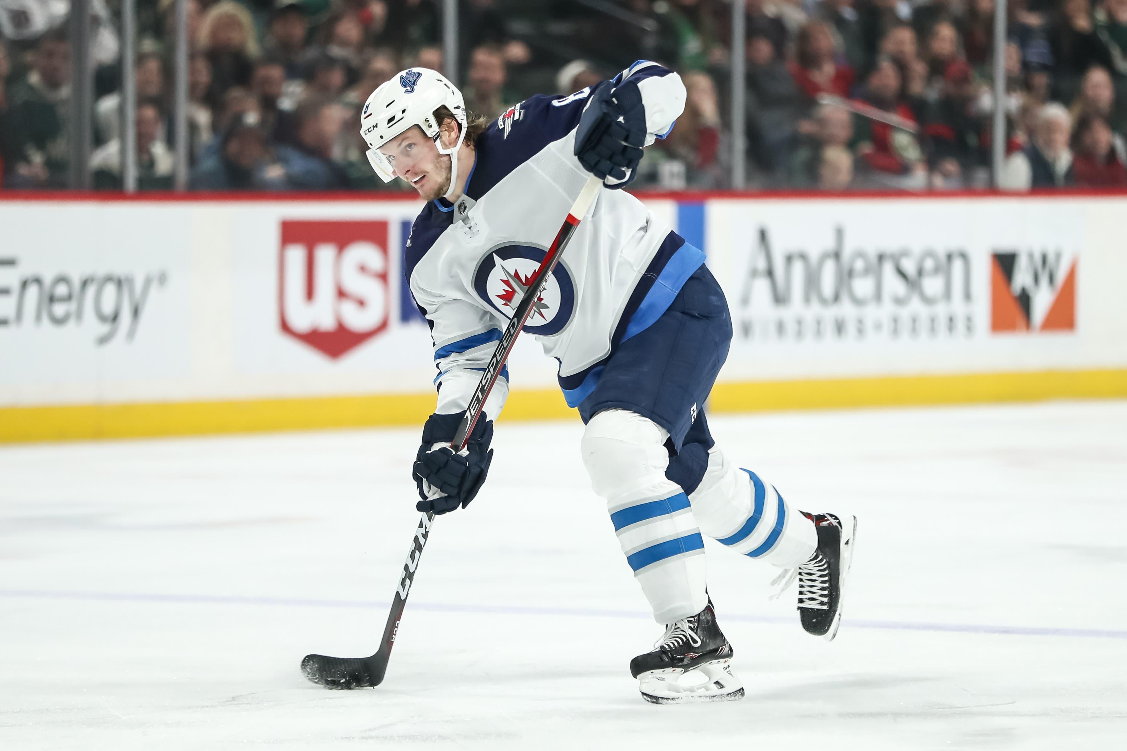 Jan 10, 2019; Saint Paul, MN, USA; Winnipeg Jets defenseman Jacob Trouba (8) shoots during the first period against the Minnesota Wild at Xcel Energy Center. Mandatory Credit: Brace Hemmelgarn-USA TODAY Sports / Brace Hemmelgarn