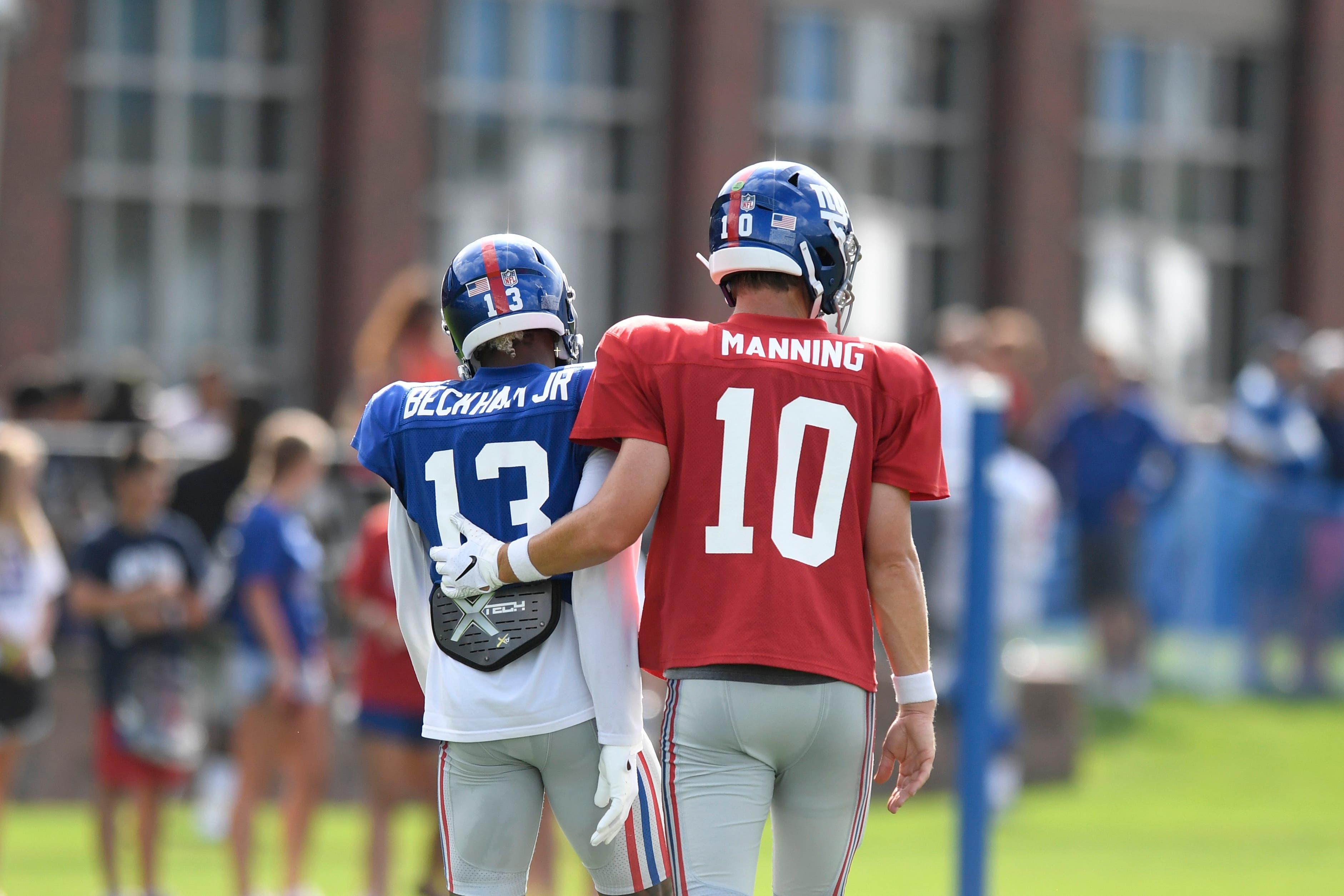 Aug 1, 2018; East Rutherford, NJ, USA; New York Giants wide receiver Odell Beckham Jr. (13) and quarterback Eli Manning (10) walk off the field together after during training camp in East Rutherford. Mandatory Credit: Danielle Parhizkaran/NorthJersey.com via USA TODAY NETWORK / Danielle Parhizkaran