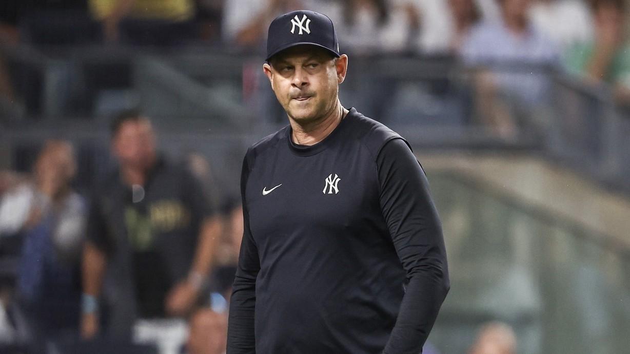 New York Yankees manager Aaron Boone (17) walks off the field after being ejected in the seventh inning against the Atlanta Braves at Yankee Stadium.
