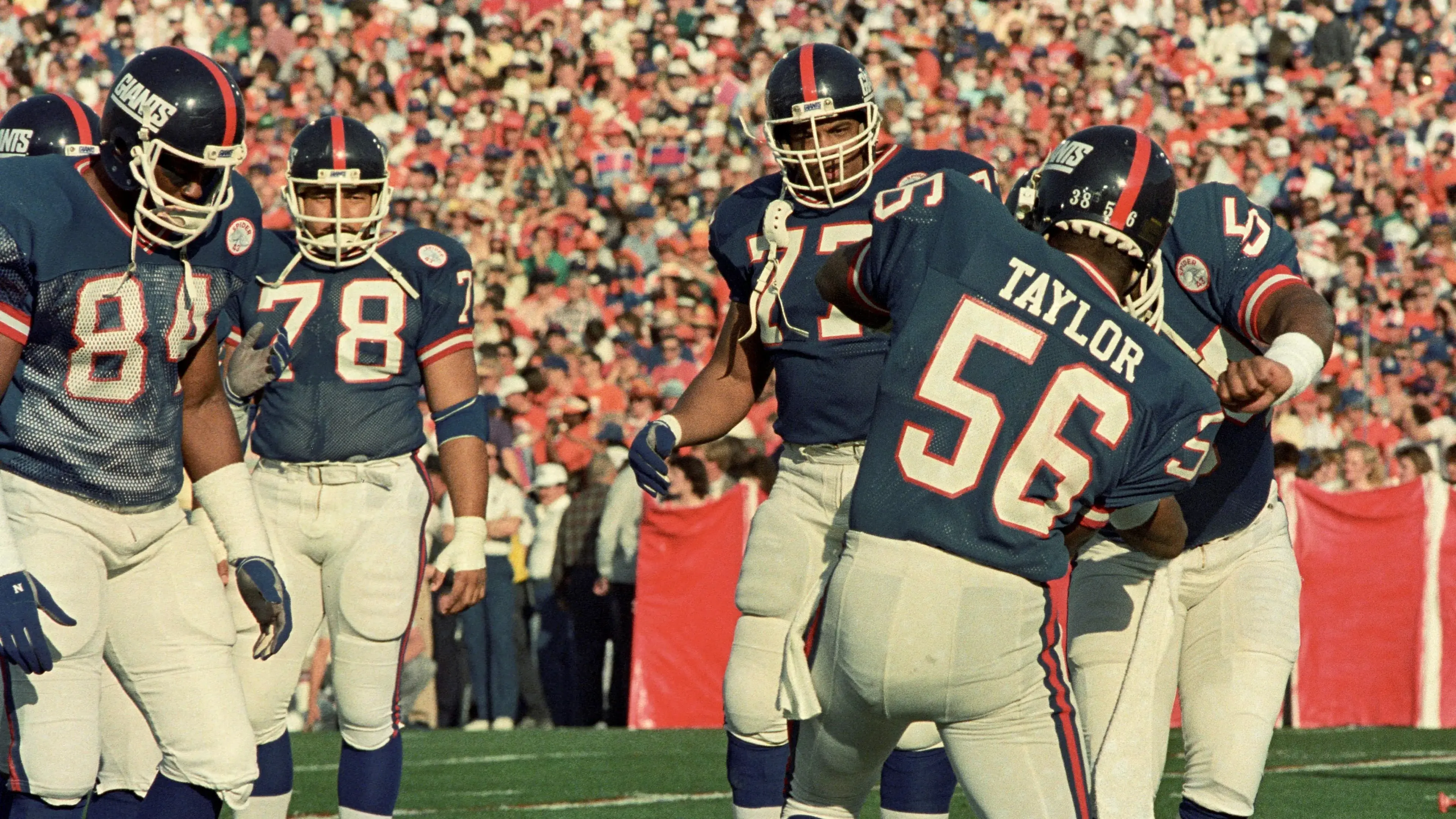 Jan 25, 1987; Pasadena, CA, USA; FILE PHOTO; New York Giants tackle Zeke Mowatt (84), nose tackle Jerome Sally (78),defensive end Eric Dorsey (77) and linebacker Lawrence Taylor (56) react on the field against the Denver Broncos during Super Bowl XXI at the Rose Bowl. The Giants defeated the Broncos 39-20. Mandatory Credit: Bob Deutsch-USA TODAY Sports / Bob Deutsch-USA TODAY Sports