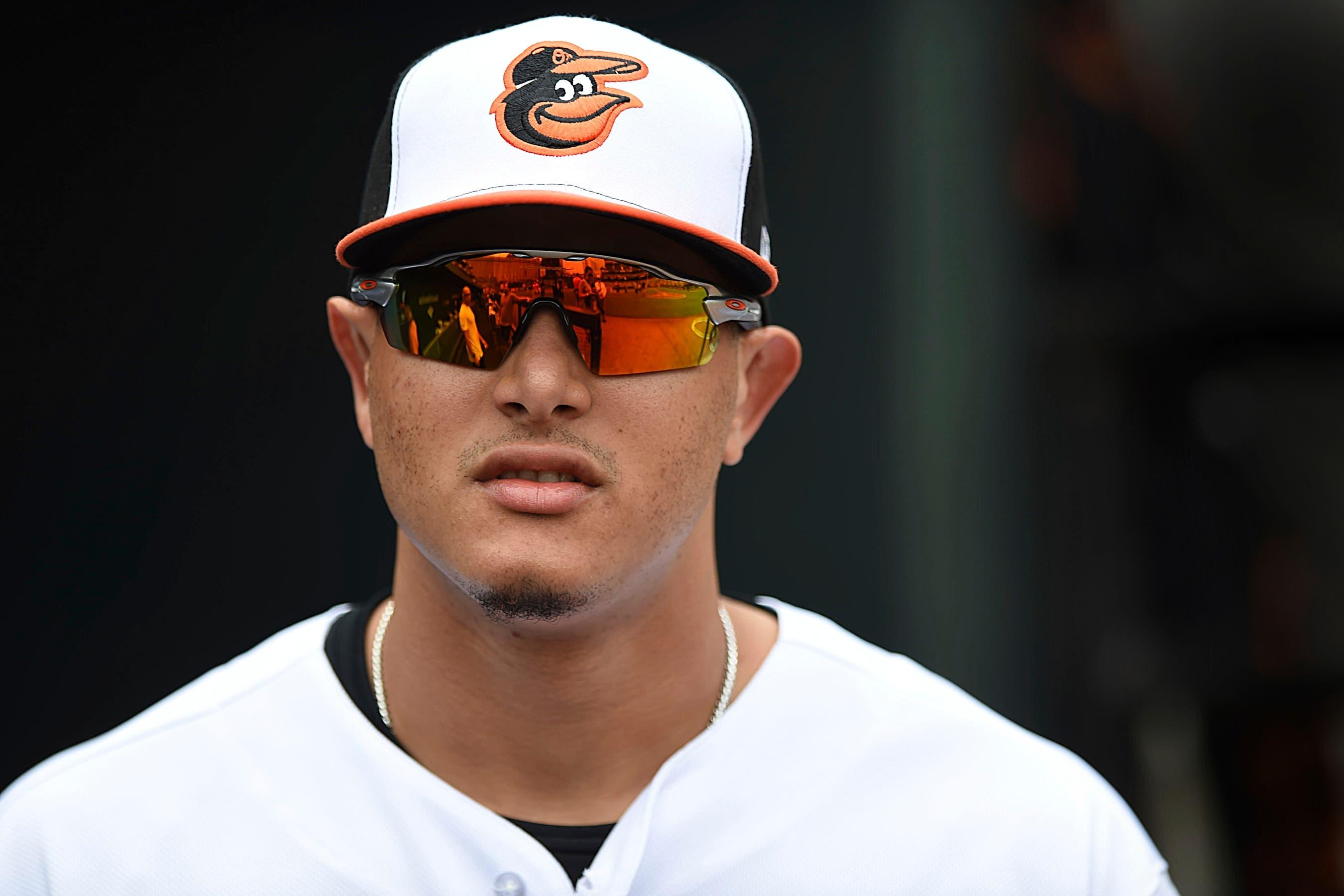 Baltimore Orioles' Manny Machado, waits in the dugout before being presented with his All-Star jersey before playing the Texas Rangers in a baseball game, Sunday, July 15, 2018, in Baltimore. (AP Photo/Gail Burton) / Gail Burton/AP