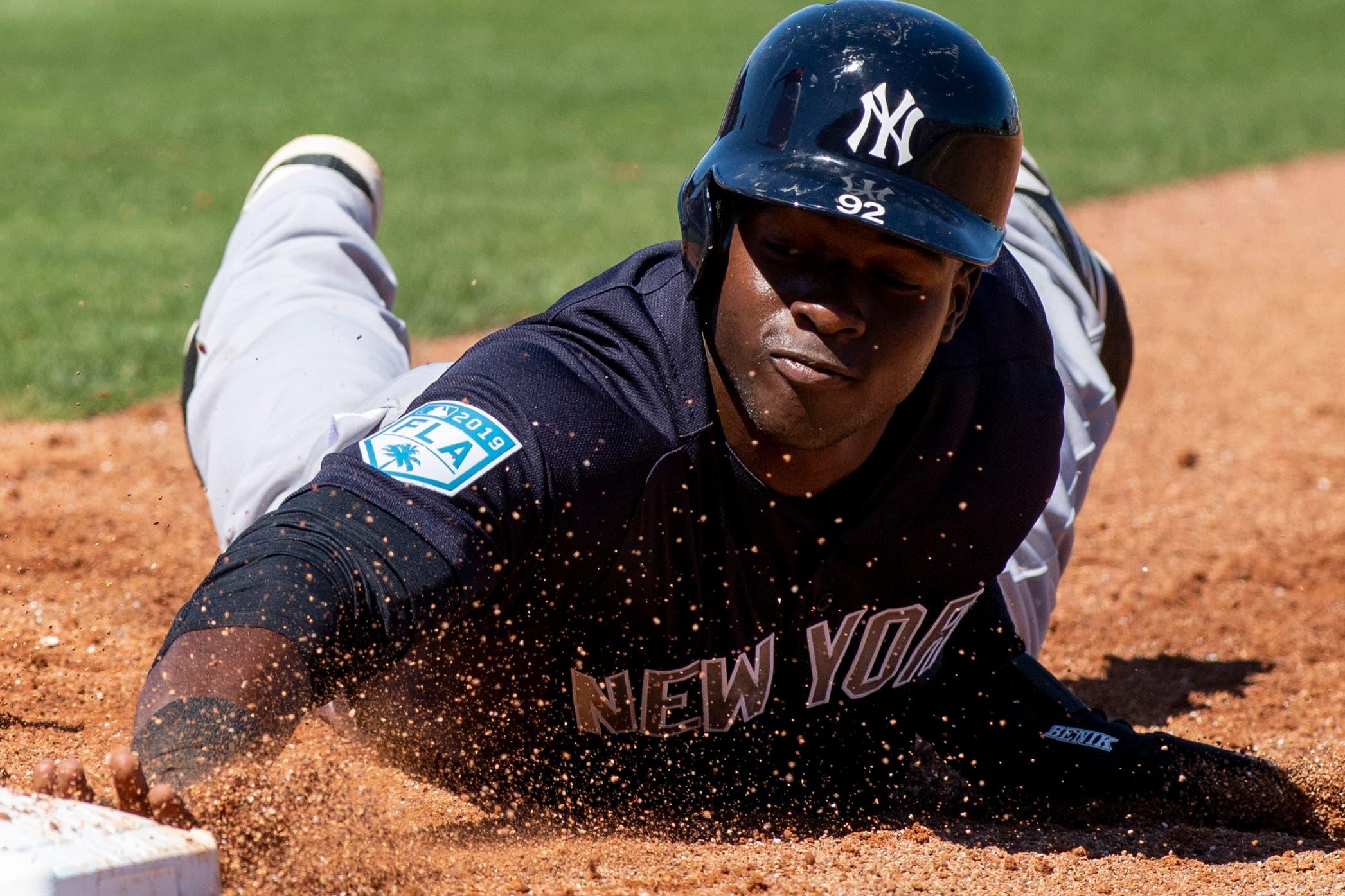 Mar 7, 2019; Clearwater, FL, USA; New York Yankees outfielder Estevan Florial (92) safely slides back into first base during the third inning against the Philadelphia Phillies at Spectrum Field. Mandatory Credit: Douglas DeFelice-USA TODAY Sports / Douglas DeFelice