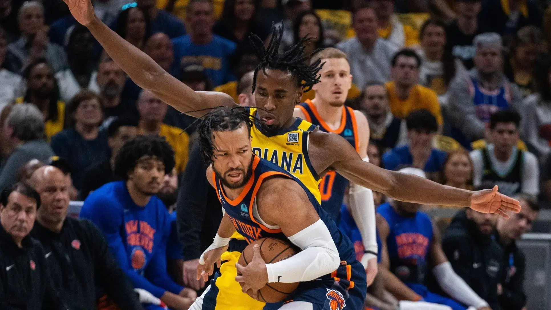May 12, 2024; Indianapolis, Indiana, USA; New York Knicks guard Jalen Brunson (11) holds the ball while Indiana Pacers forward Aaron Nesmith (23) defends during game four of the second round for the 2024 NBA playoffs at Gainbridge Fieldhouse. / Trevor Ruszkowski-USA TODAY Sports