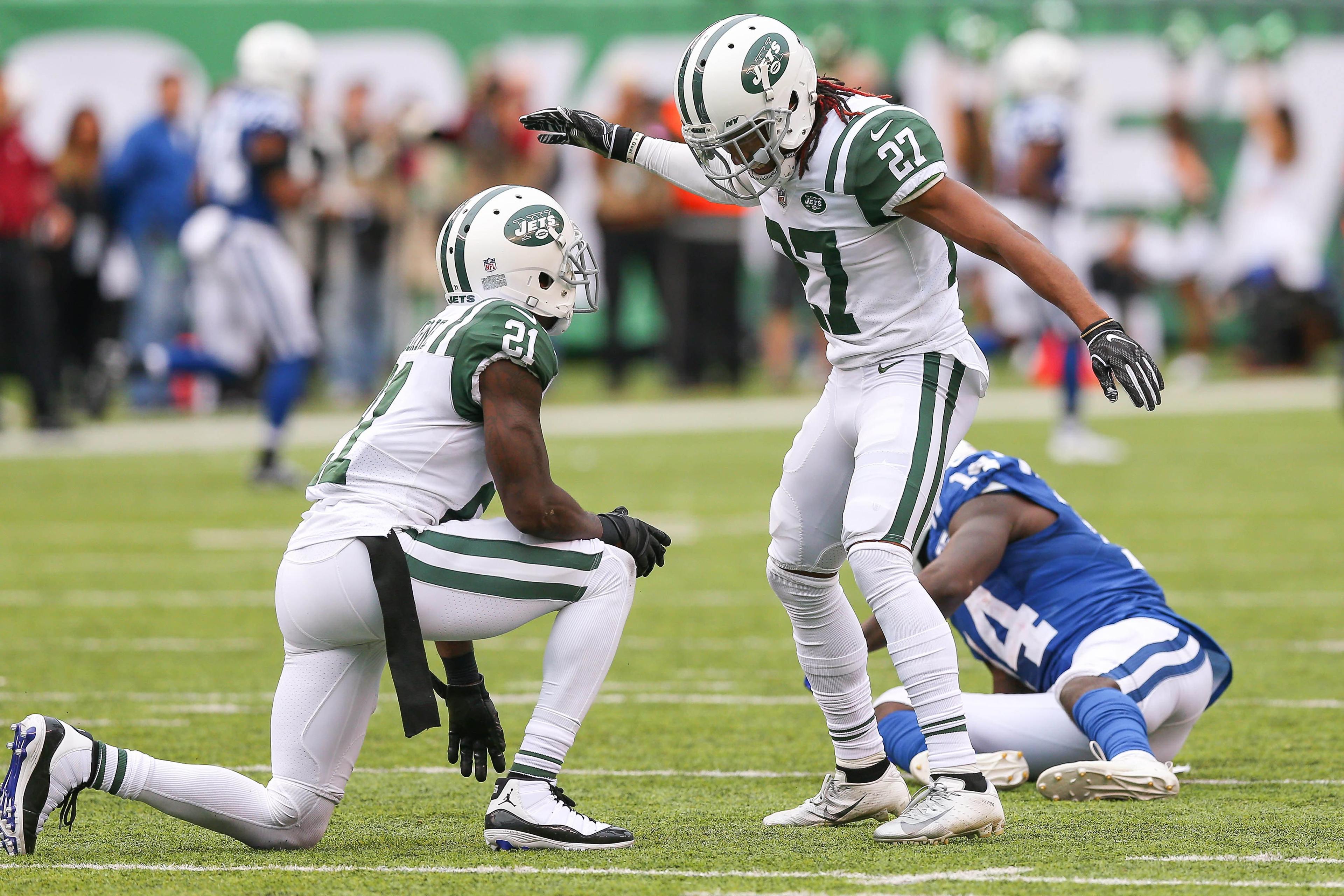 Oct 14, 2018; East Rutherford, NJ, USA; New York Jets cornerback Darryl Roberts (27) celebrates with cornerback Morris Claiborne (21) in front of Indianapolis Colts wide receiver Zach Pascal (14) during the second half at MetLife Stadium. Mandatory Credit: Vincent Carchietta-USA TODAY Sports / Vincent Carchietta