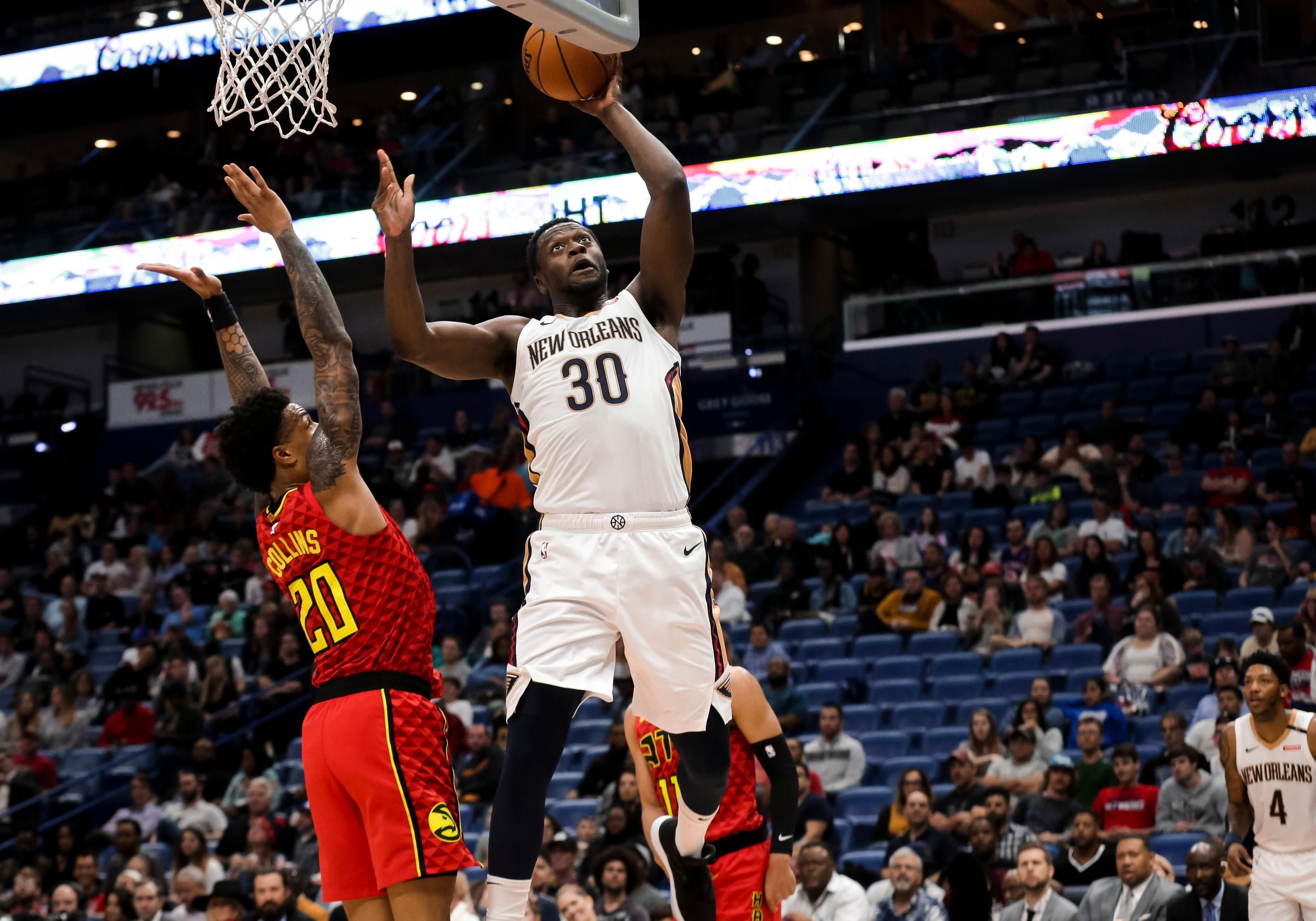 Mar 26, 2019; New Orleans, LA, USA; New Orleans Pelicans center Julius Randle (30) shoots over Atlanta Hawks forward John Collins (20) during the second half at the Smoothie King Center. Mandatory Credit: Derick E. Hingle-USA TODAY Sports