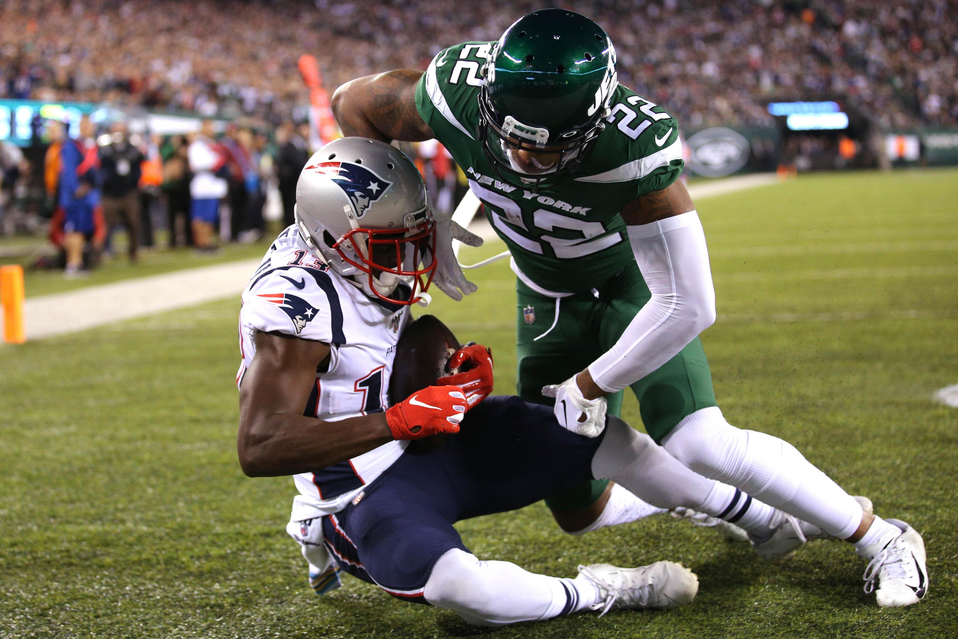 Oct 21, 2019; East Rutherford, NJ, USA; New England Patriots wide receiver Phillip Dorsett II (13) catches a touchdown pass against New York Jets cornerback Trumaine Johnson (22) during the first quarter at MetLife Stadium. Mandatory Credit: Brad Penner-USA TODAY Sports