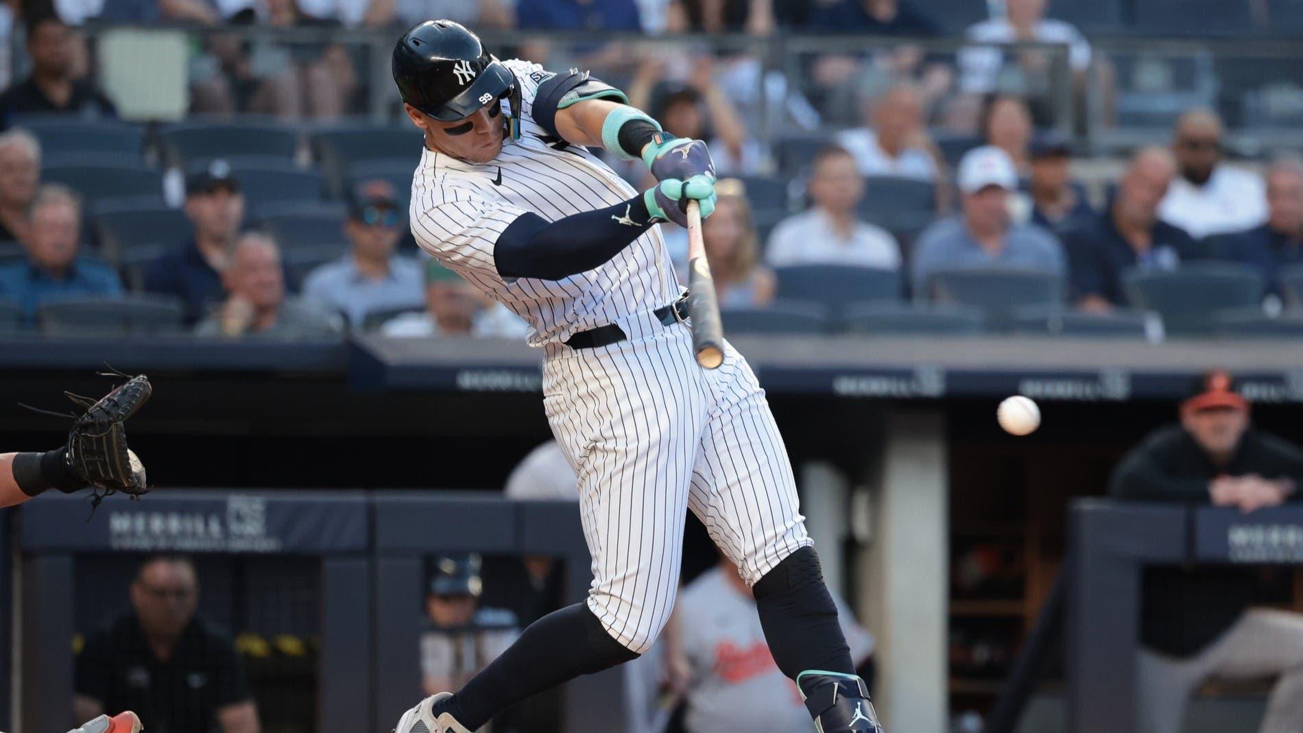 Jun 18, 2024; Bronx, New York, USA; New York Yankees center fielder Aaron Judge (99) singles during the first inning against the Baltimore Orioles at Yankee Stadium. / Vincent Carchietta-USA TODAY Sports