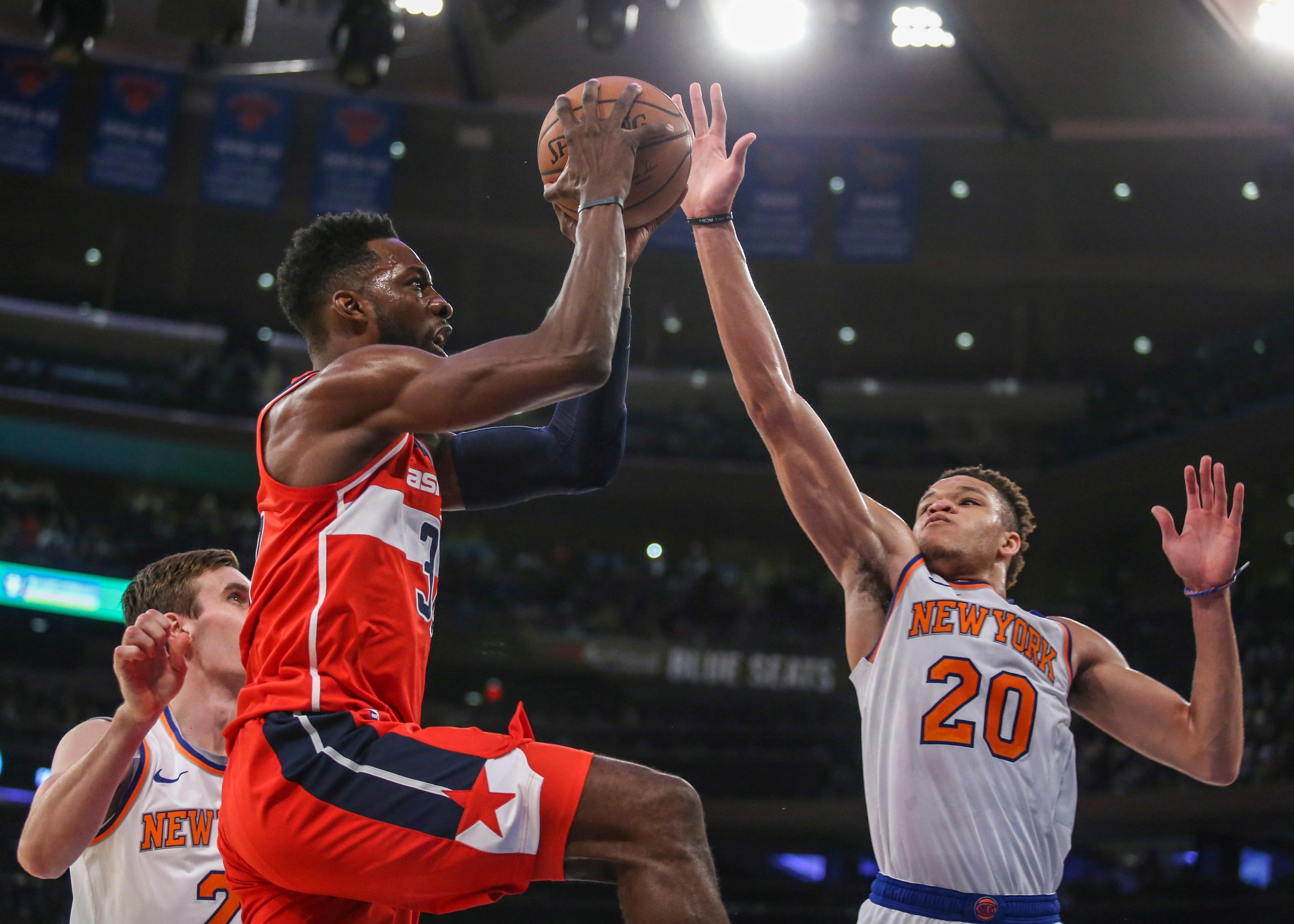 Washington Wizards forward Jeff Green shoots against New York Knicks guard Kevin Knox in the first quarter at Madison Square Garden. / Wendell Cruz/USA TODAY Sports