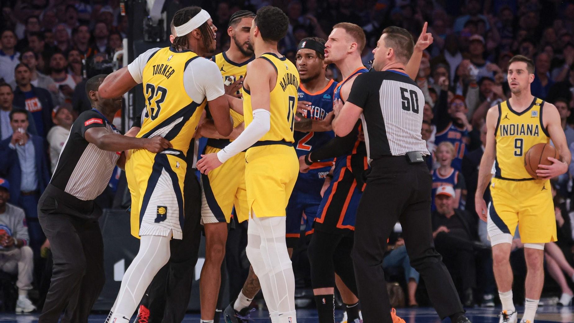 May 14, 2024; New York, New York, USA; Indiana Pacers center Myles Turner (33) argues with New York Knicks guard Donte DiVincenzo (0) during the second half during game five of the second round for the 2024 NBA playoffs at Madison Square Garden.