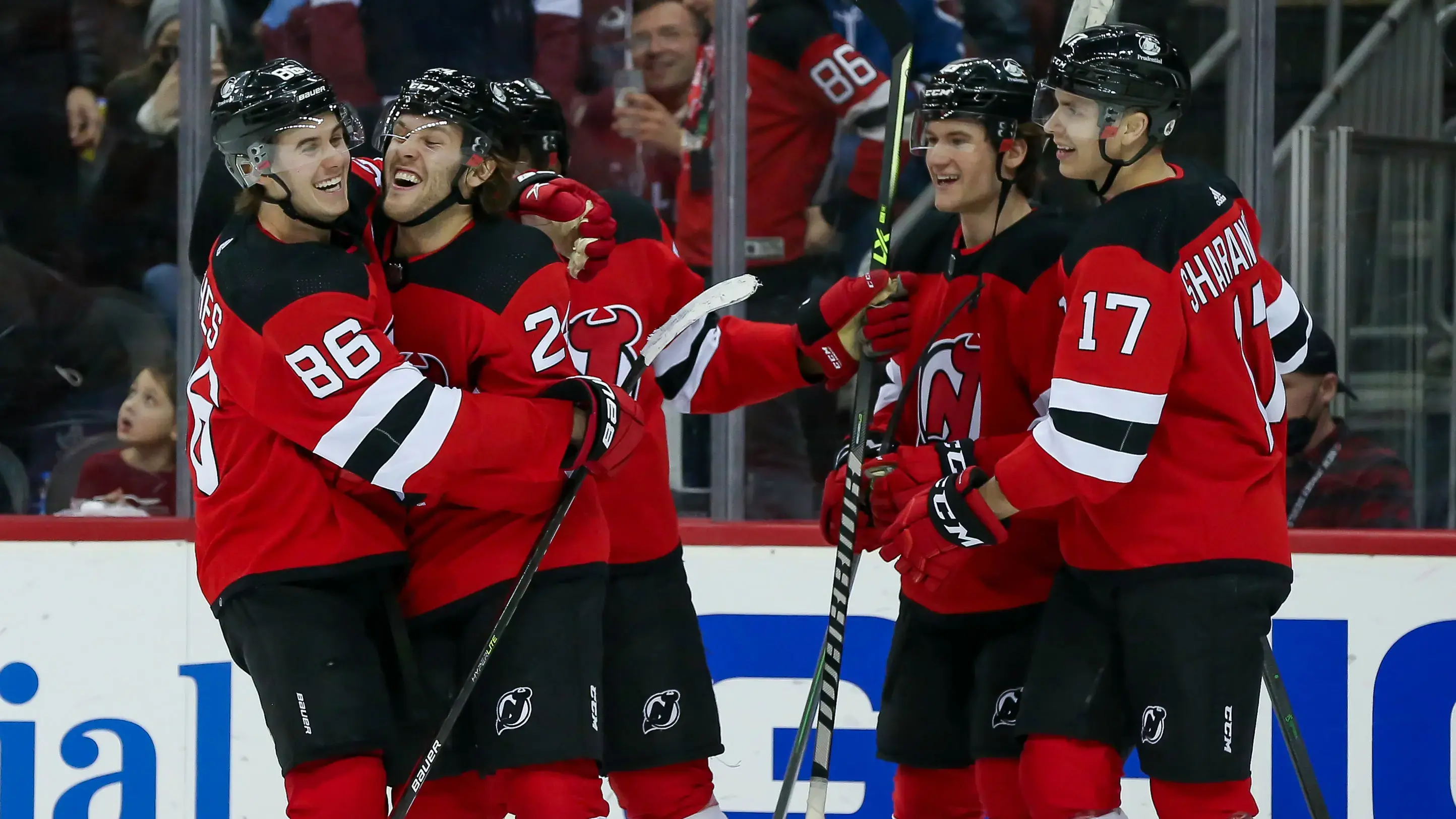 Mar 8, 2022; Newark, New Jersey, USA; New Jersey Devils defenseman Ty Smith (24) celebrates with New Jersey Devils center Jack Hughes (86), New Jersey Devils center Dawson Mercer (18) and New Jersey Devils center Yegor Sharangovich (17) after scoring a goal against Colorado Avalanche during the second period at Prudential Center. / Tom Horak-USA TODAY Sports