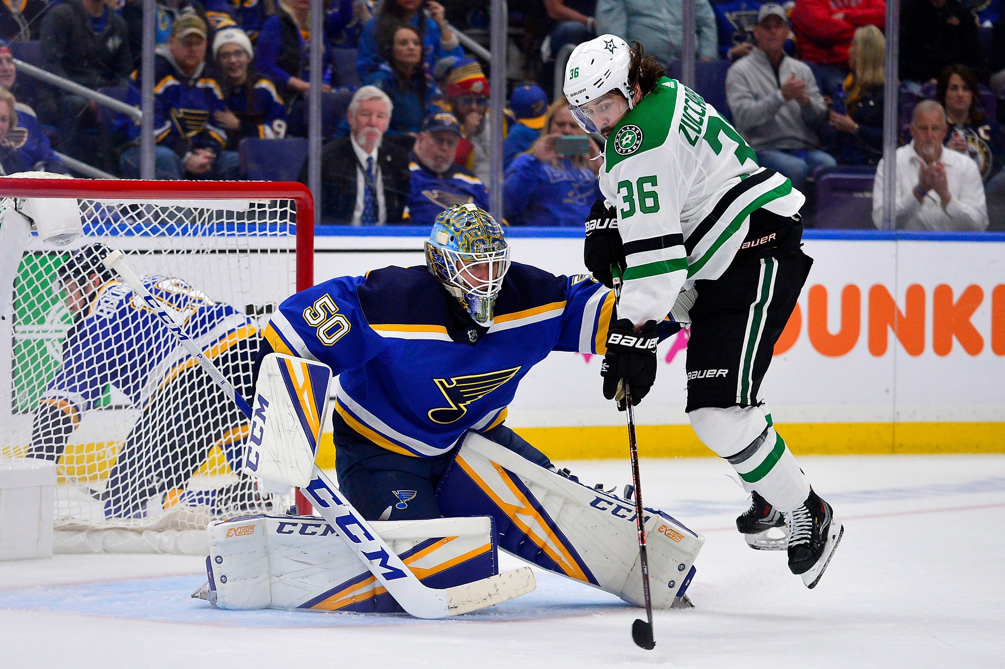 Apr 25, 2019; St. Louis, MO, USA; St. Louis Blues goaltender Jordan Binnington (50) defends the goal against Dallas Stars center Mats Zuccarello (36) during the third period in game one of the second round of the 2019 Stanley Cup Playoffs at Enterprise Center. Mandatory Credit: Jeff Curry-USA TODAY Sports / Jeff Curry