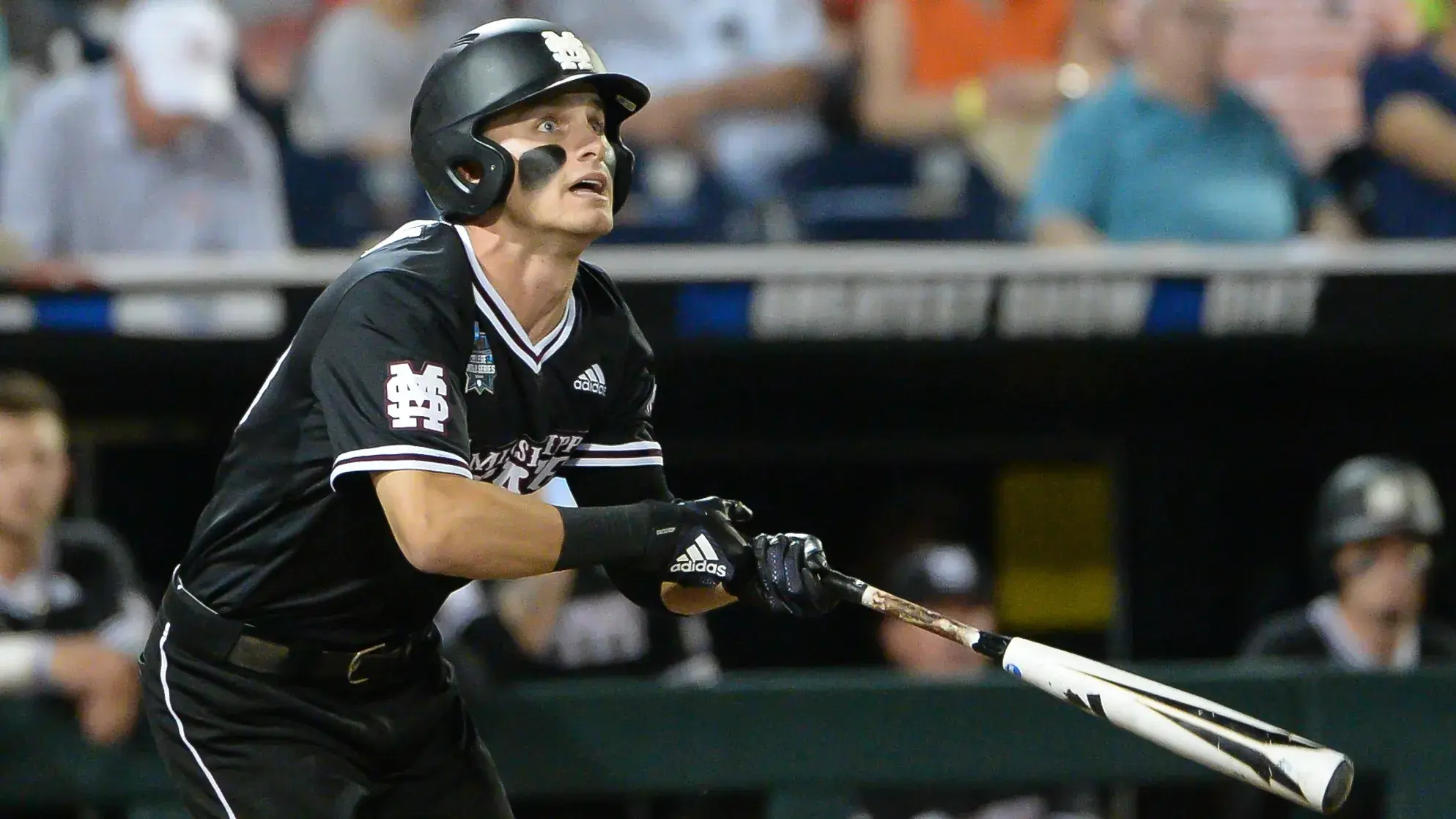 Mississippi State Bulldogs outfielder Jake Mangum (15) double to lead off the ninth inning against the Auburn Tigers in the 2019 College World Series at TD Ameritrade Park. / Steven Branscombe-USA TODAY Sports