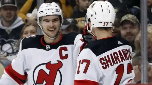 New Jersey Devils center Nico Hischier (13) celebrates with center Yegor Sharangovich (17) after Hischier scored a goal against the Pittsburgh Penguins during the second period at PPG Paints Arena / Charles LeClaire - USA TODAY Sports