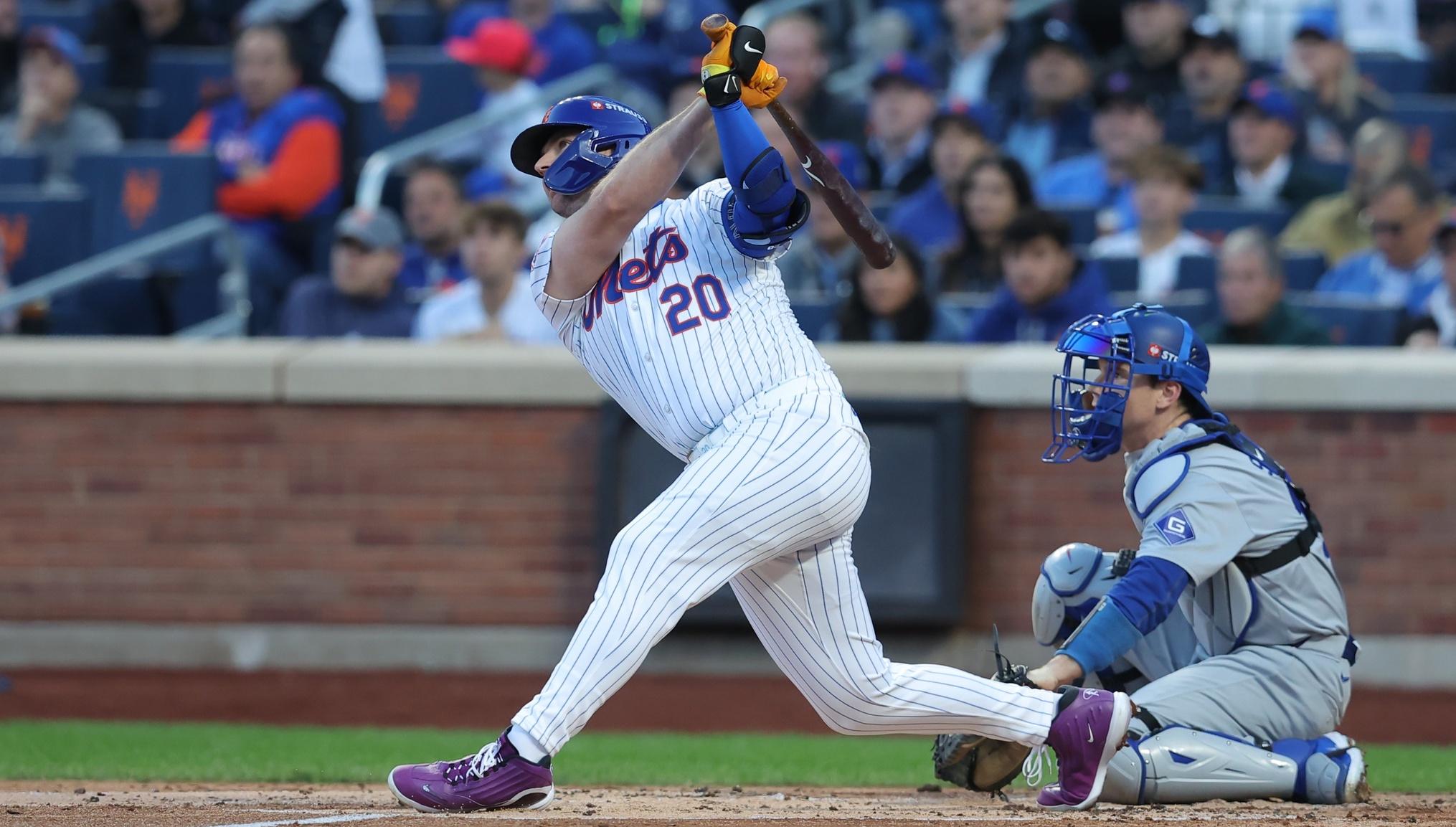 New York Mets first base Pete Alonso (20) hits a three-run home run in the first inning against the Los Angeles Dodgers during game five of the NLCS for the 2024 MLB playoffs at Citi Field.