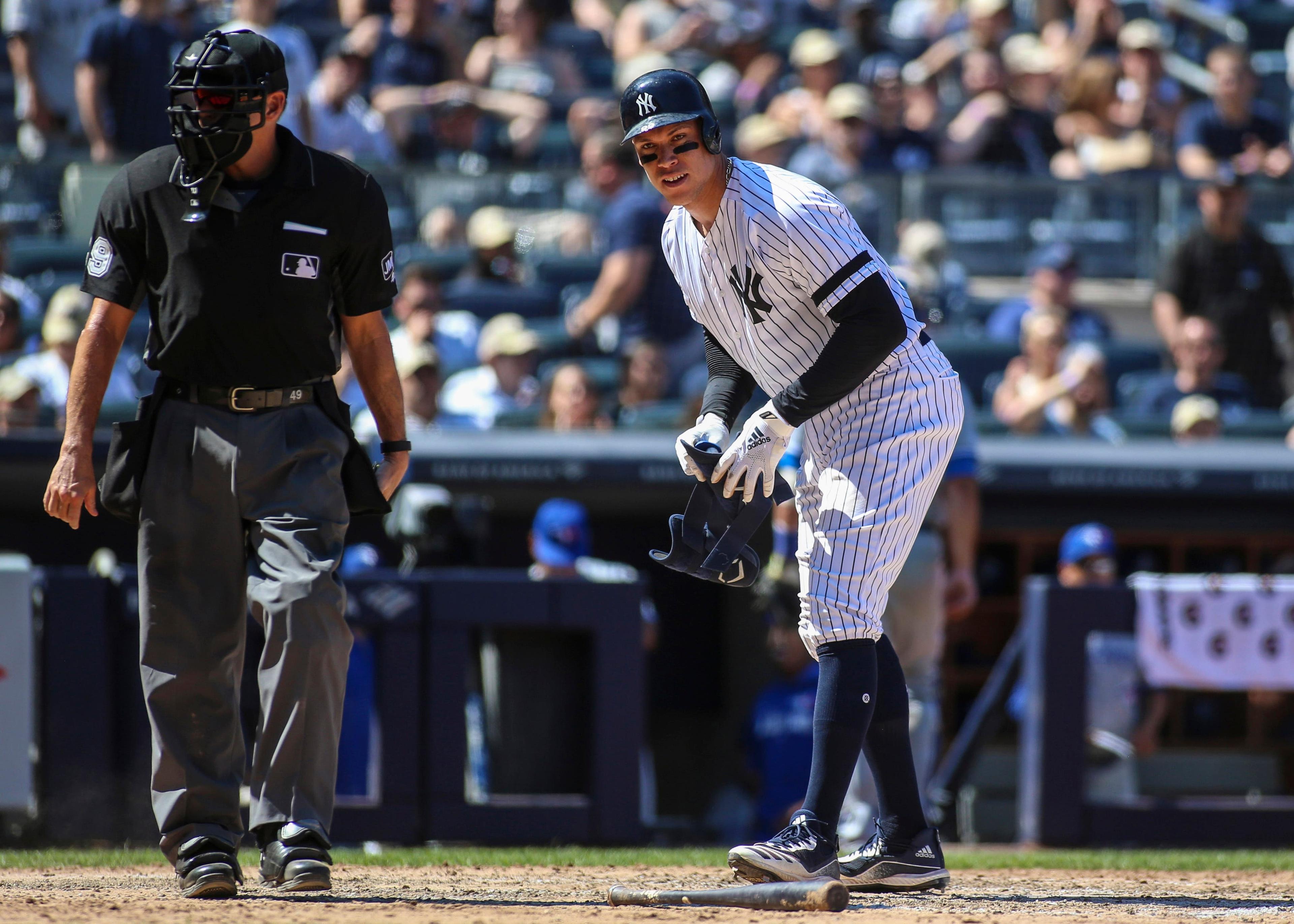 Jul 13, 2019; Bronx, NY, USA; New York Yankees right fielder Aaron Judge (99) stares at home plate umpire Andy Fletcher (49) after being called out on strikes against the Toronto Blue Jays in the seventh inning at Yankee Stadium. Mandatory Credit: Wendell Cruz-USA TODAY Sports / Wendell Cruz