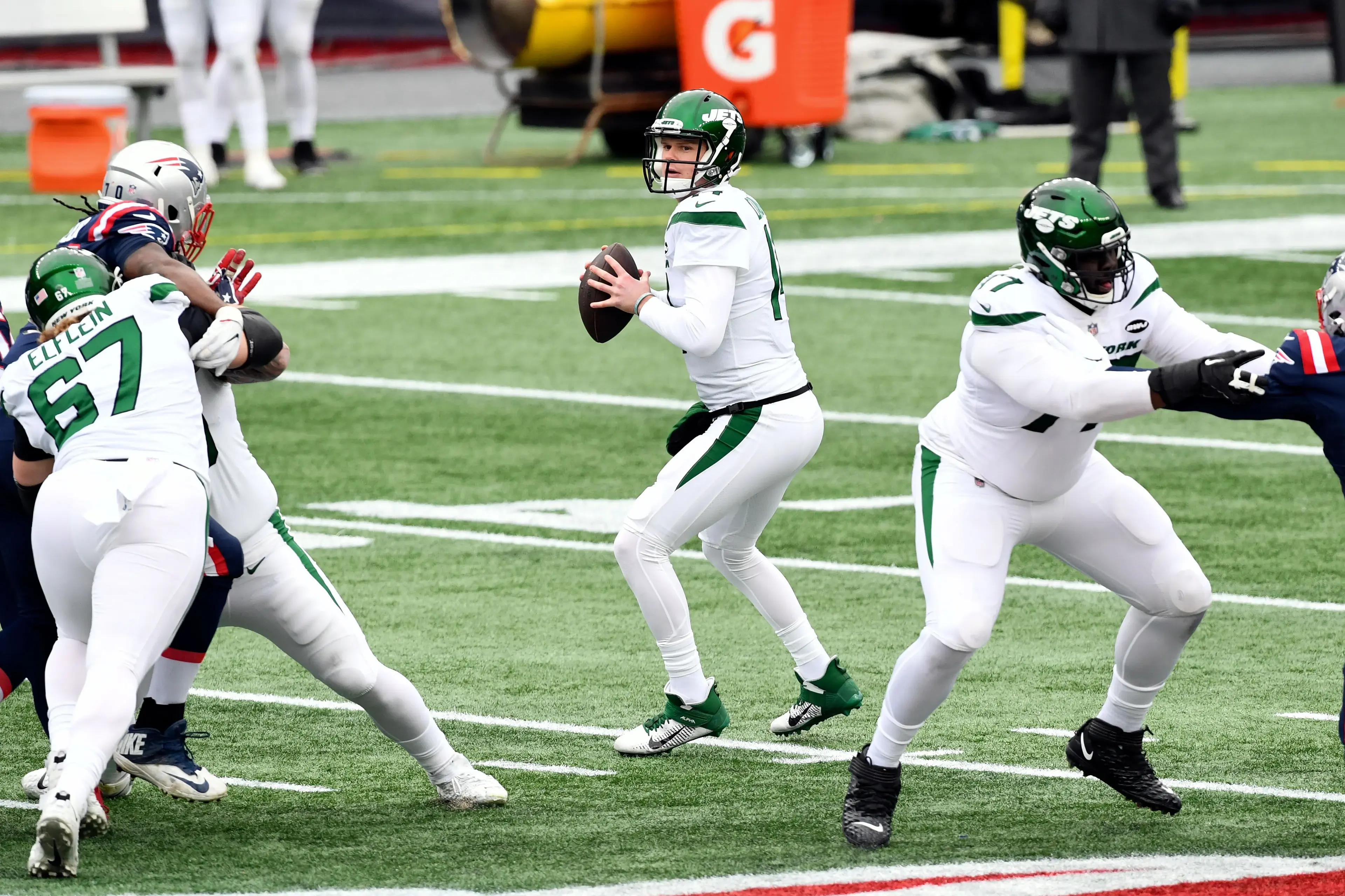 Jan 3, 2021; Foxborough, Massachusetts, USA; New York Jets quarterback Sam Darnold (14) looks to pass during the first quarter of a game against the New England Patriots at Gillette Stadium. / Brian Fluharty-USA TODAY Sports