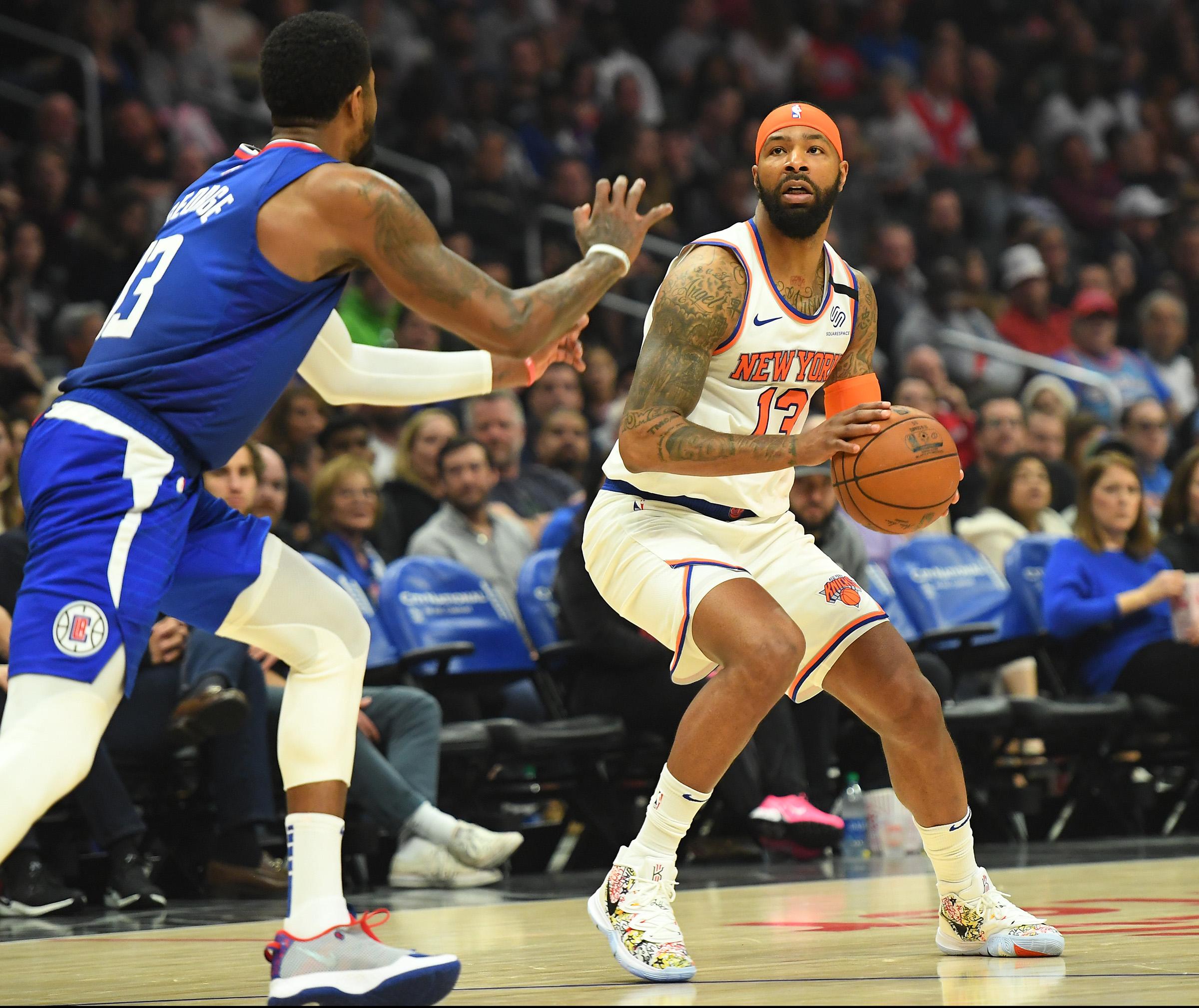 Jan 5, 2020; Los Angeles, California, USA; Los Angeles Clippers forward Paul George (13) guards New York Knicks forward Marcus Morris Sr. (13) in the first half of the game at Staples Center. Mandatory Credit: Jayne Kamin-Oncea-USA TODAY Sports