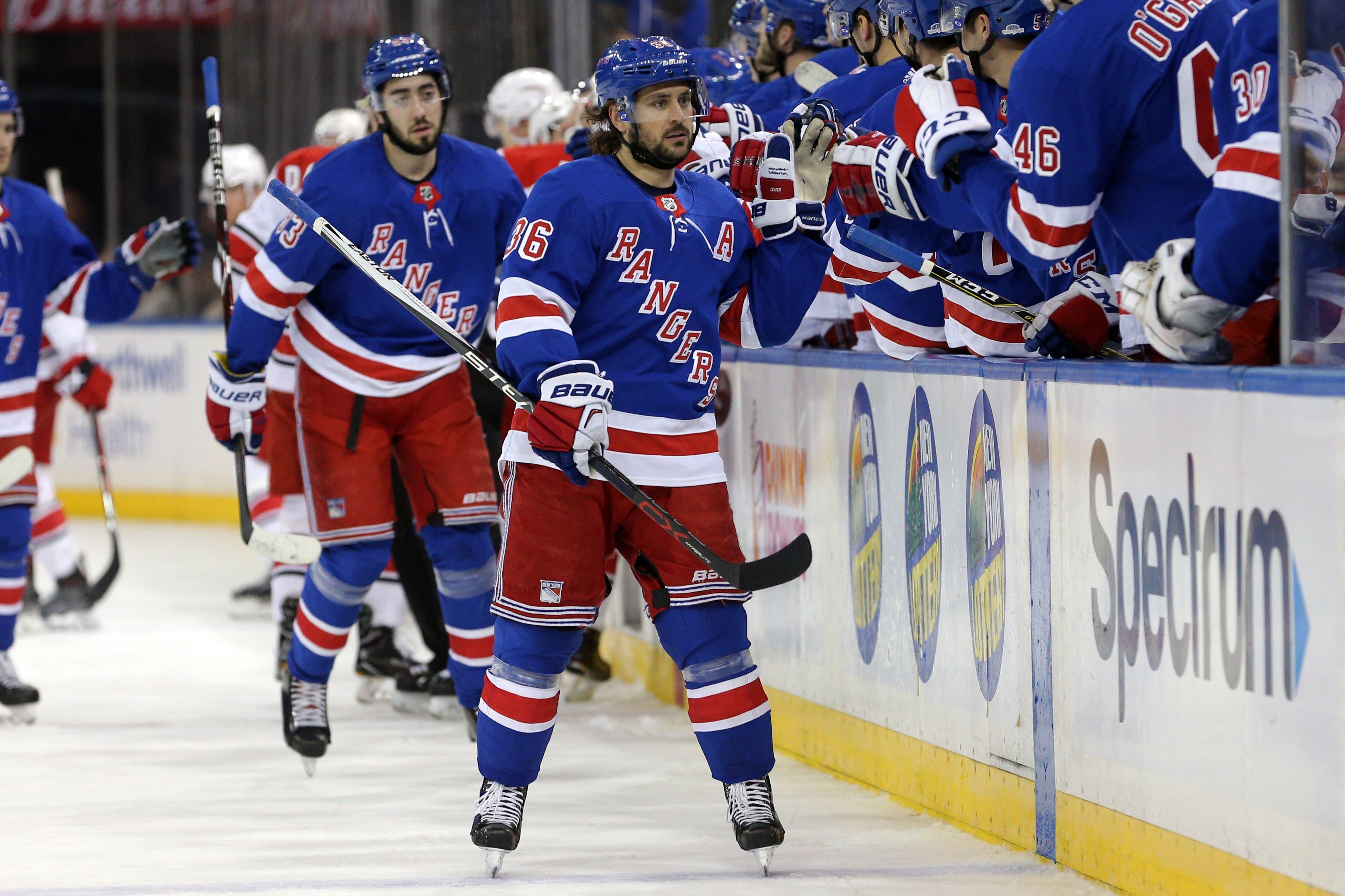 Mar 12, 2018; New York, NY, USA; New York Rangers right wing Mats Zuccarello (36) celebrates his goal against the Carolina Hurricanes with teammates during the first period at Madison Square Garden. Mandatory Credit: Brad Penner-USA TODAY Sports / Brad Penner