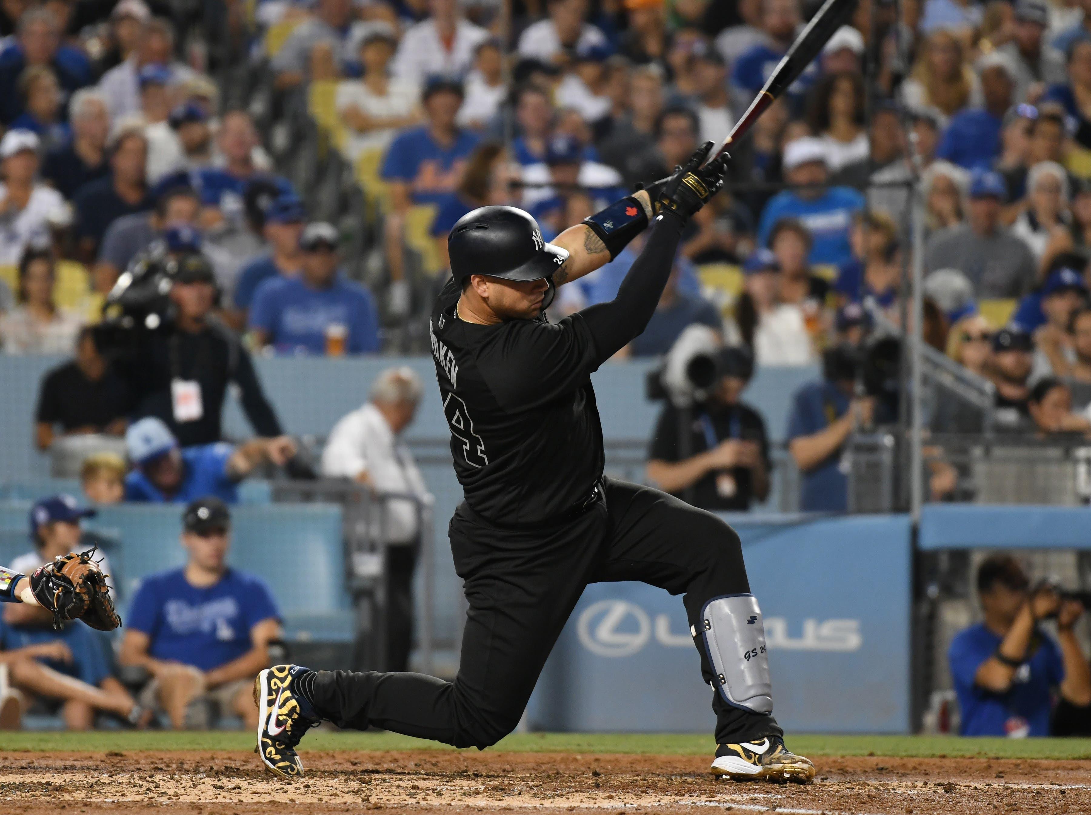 Aug 23, 2019; Los Angeles, CA, USA; New York Yankees catcher Gary Sanchez (24) hits a solo home run in the third inning against the Los Angeles Dodgers during an MLB Players' Weekend game at Dodger Stadium. Mandatory Credit: Richard Mackson-USA TODAY Sports / Richard Mackson