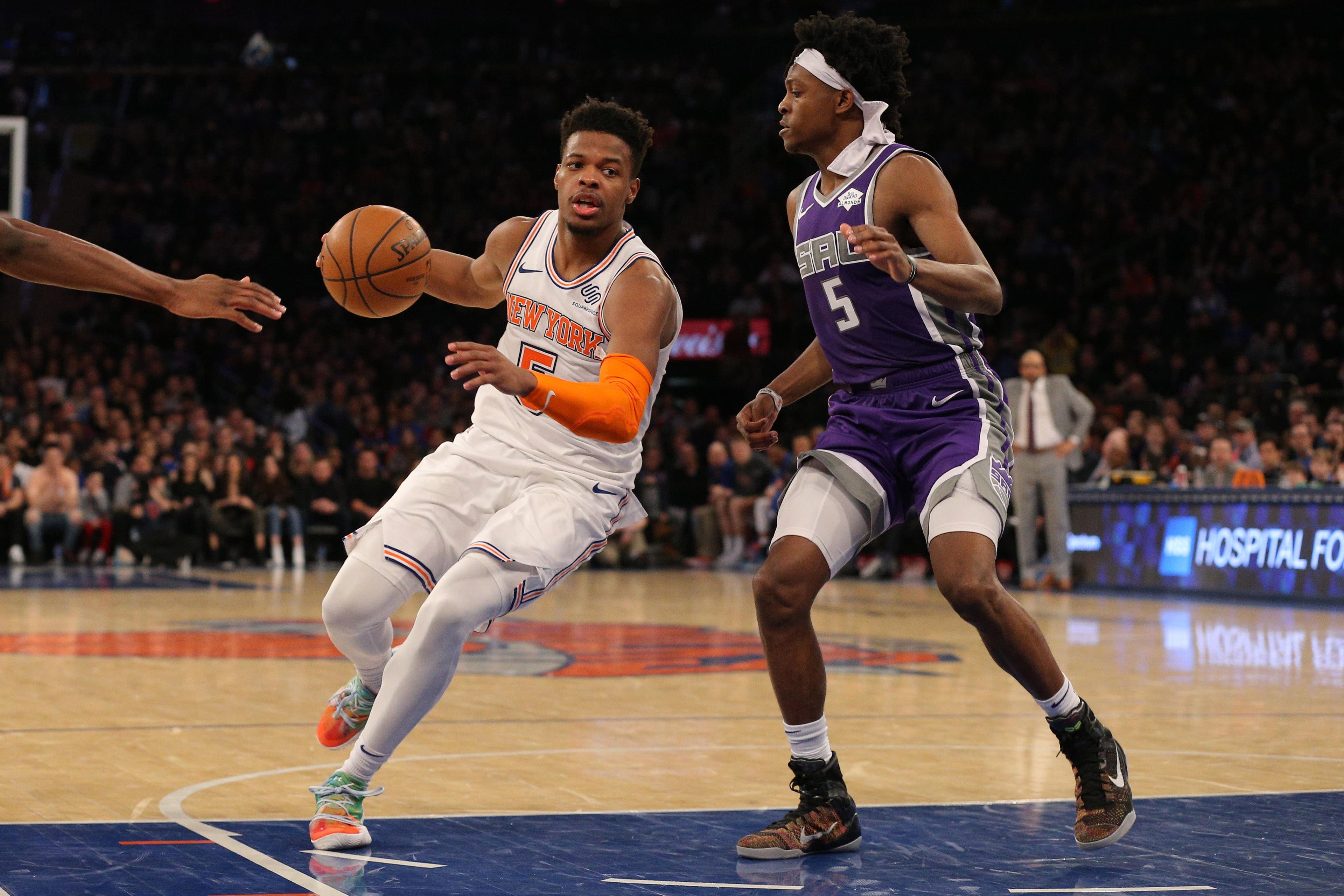 Mar 9, 2019; New York, NY, USA; New York Knicks point guard Dennis Smith Jr. (5) controls the ball against Sacramento Kings point guard De'Aaron Fox (5) during the fourth quarter at Madison Square Garden. Mandatory Credit: Brad Penner-USA TODAY Sports / Brad Penner