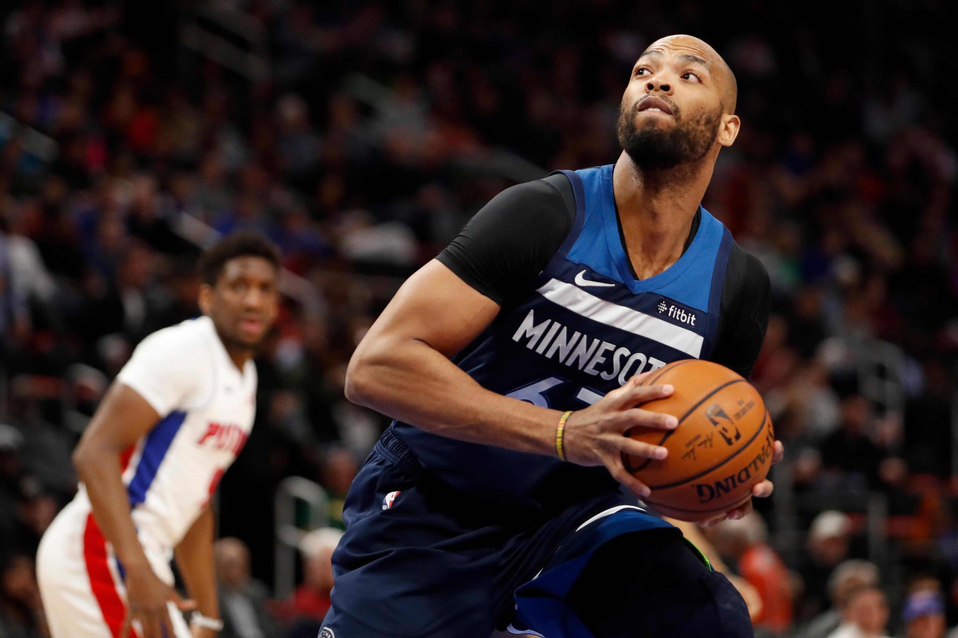 Minnesota Timberwolves forward Taj Gibson controls the ball during the second quarter against the Detroit Pistons at Little Caesars Arena. / Raj Mehta/USA TODAY Sports