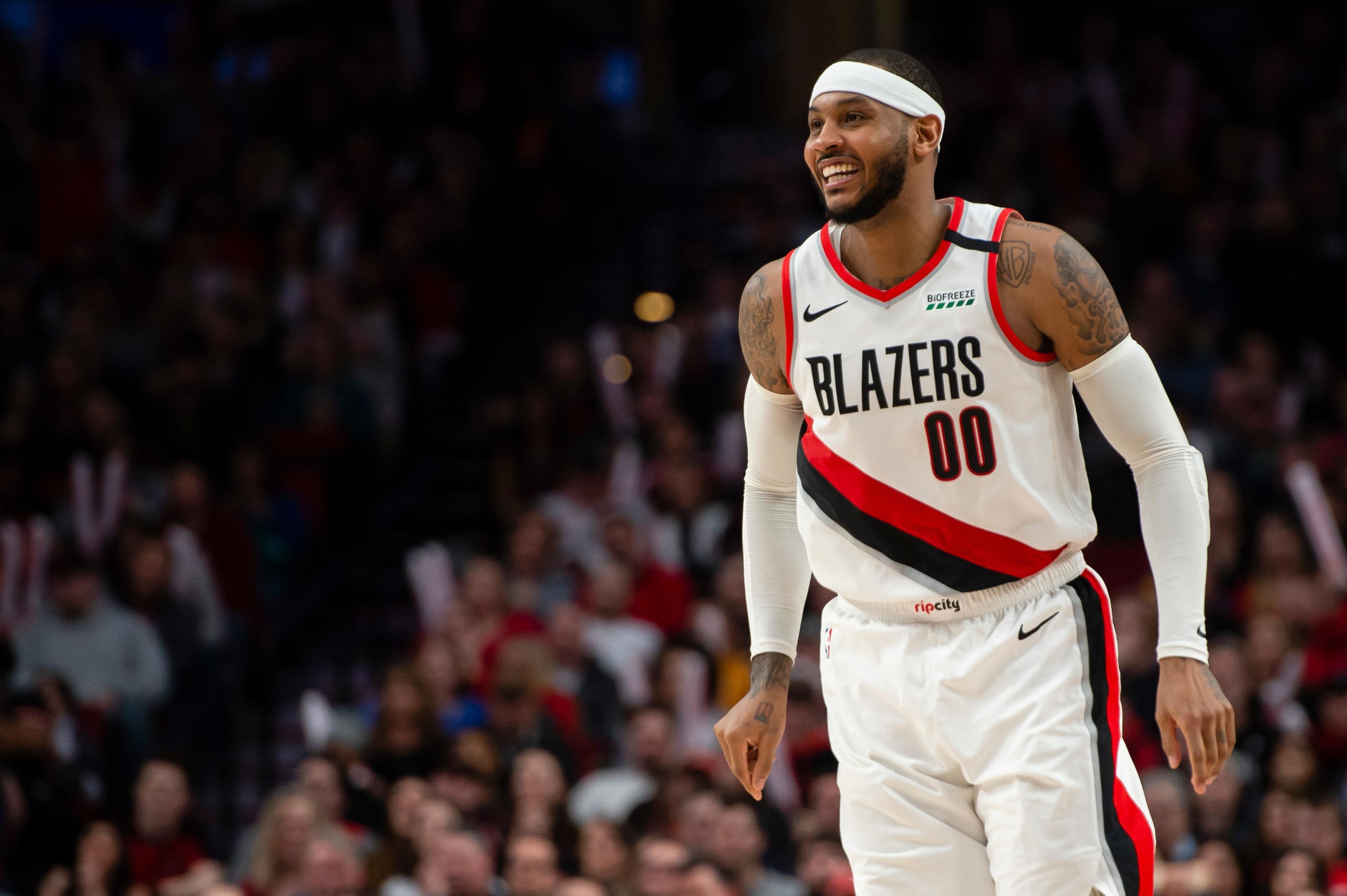 Feb 1, 2020; Portland, Oregon, USA; Portland Trail Blazers forward Carmelo Anthony (00) smiles during the second half against the Utah Jazz at Moda Center. The Trail Blazers won 127-107. Mandatory Credit: Troy Wayrynen-USA TODAY Sports