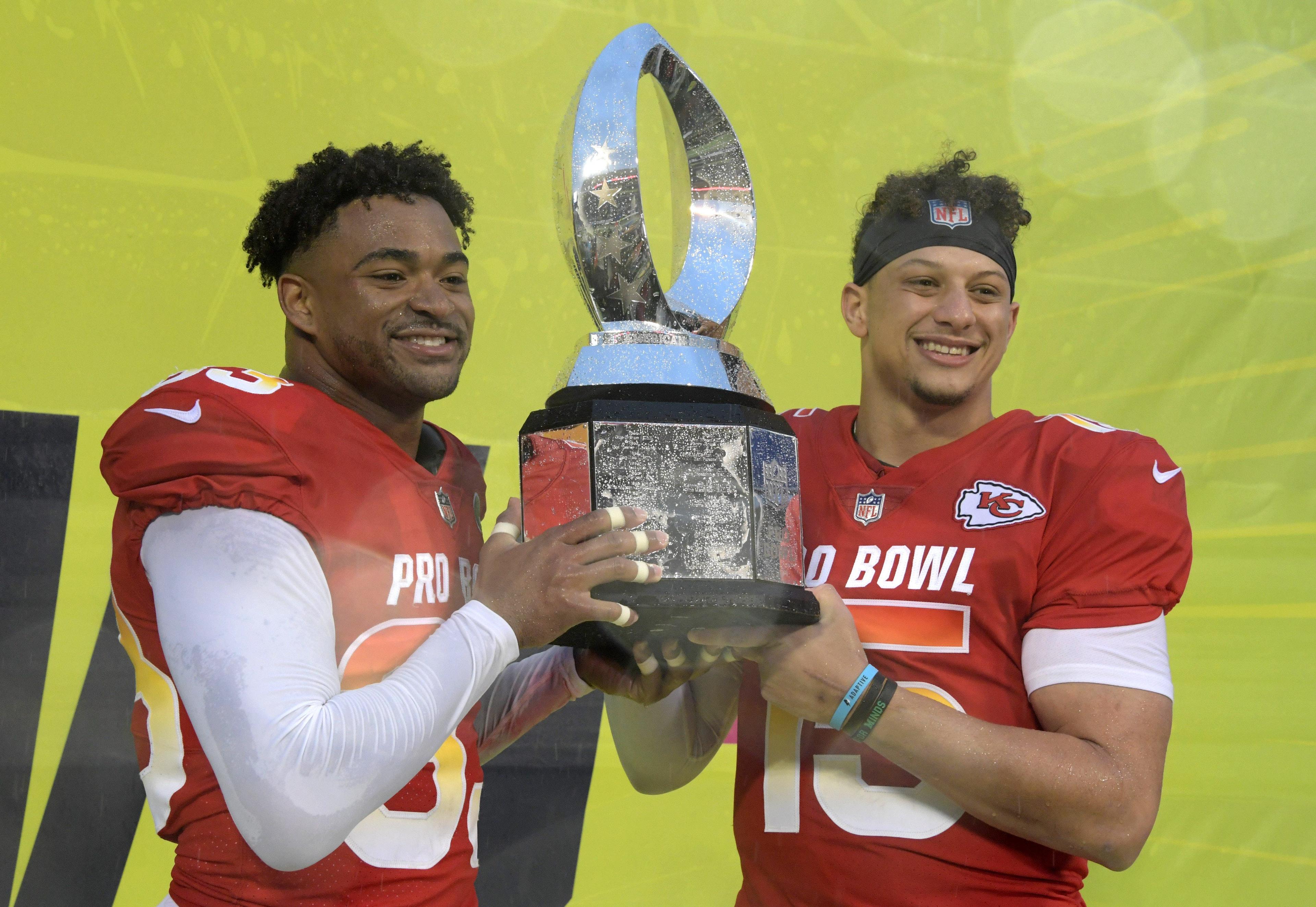 AFC safety Jamal Adams and quarterback Patrick Mahomes of the Kansas City Chiefs pose with trophy after being selected as most valuable defensive and offensive players of the game in the NFL Pro Bowl at Camping World Stadium. / Kirby Lee/USA TODAY Sports