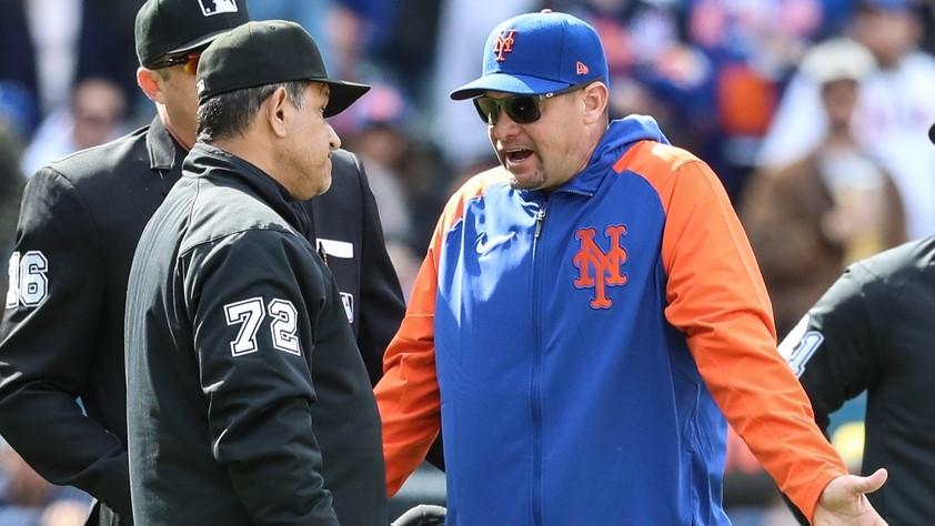 Mar 30, 2024; New York City, New York, USA; New York Mets manager Carlos Mendoza (64) argues with umpire Alfonso Marquez (72) in the seventh inning against the Milwaukee Brewers at Citi Field. 