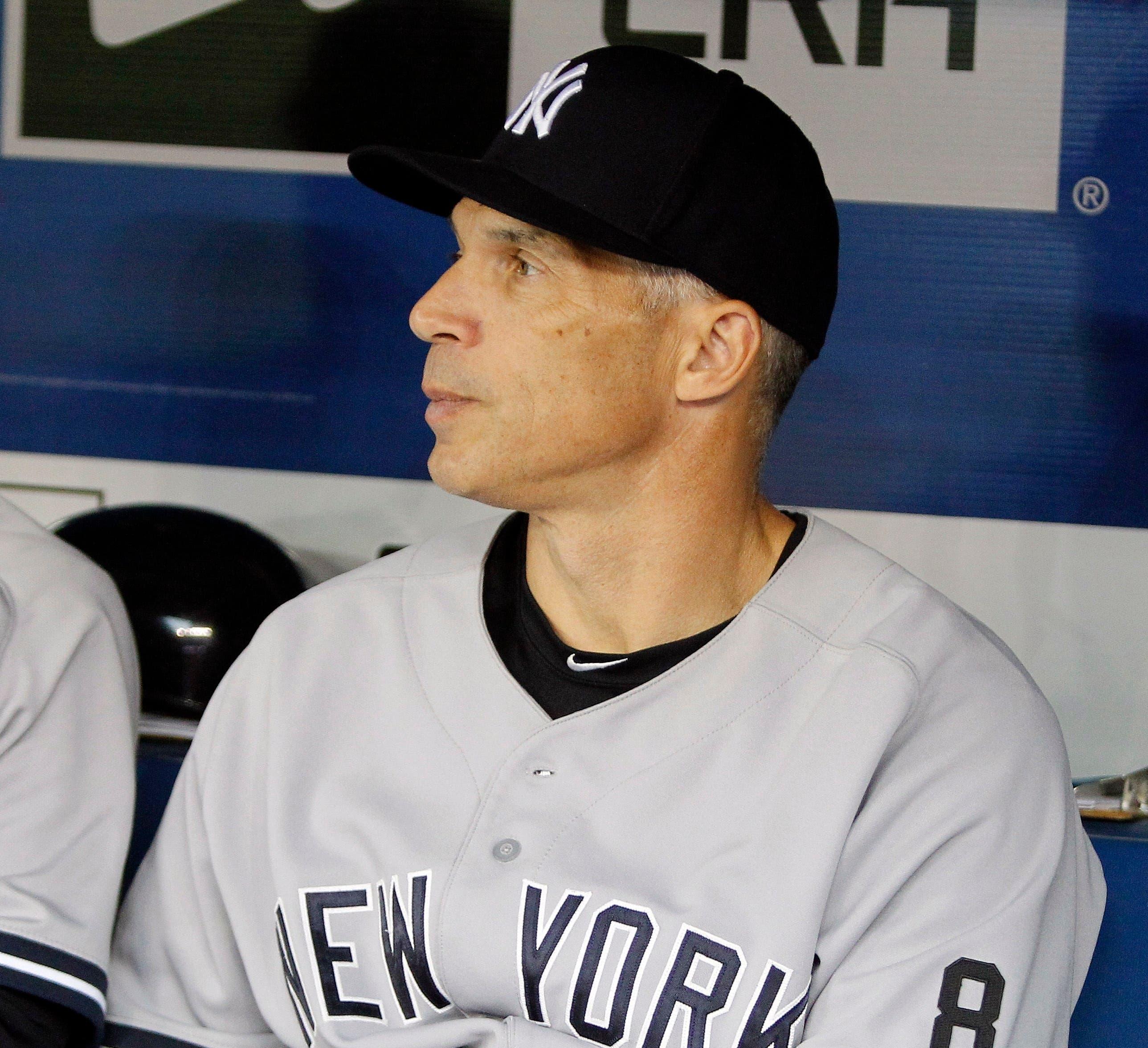 Sep 23, 2015; Toronto, Ontario, CAN; New York Yankees manager Joe Giradi wears the number 8 on his sleeve in tribute to former Yankee player Yogi Berra prior to the start of the game against the Toronto Blue Jays at Rogers Centre. Mandatory Credit: John E. Sokolowski-USA TODAY Sports / John E. Sokolowski