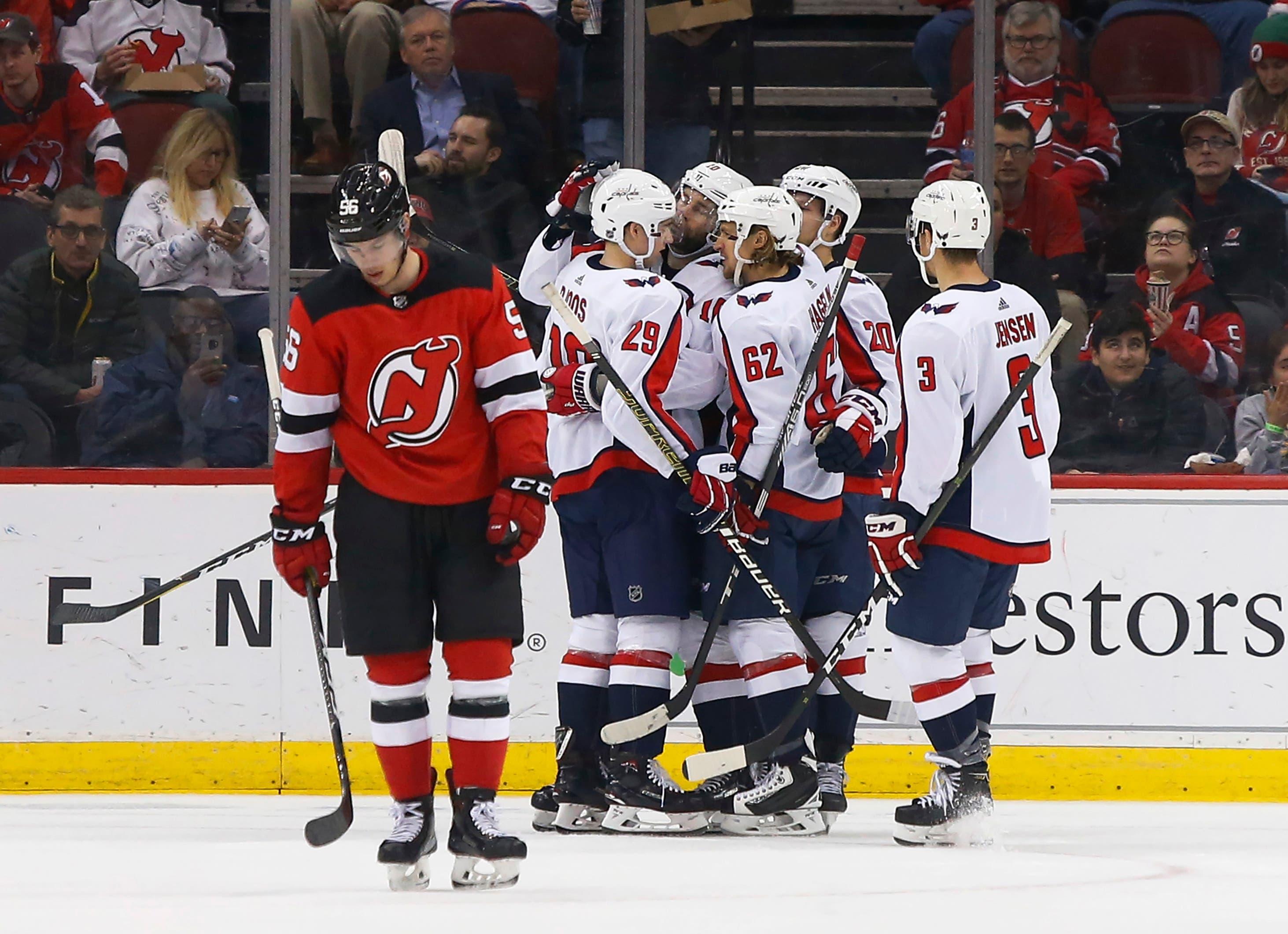 Mar 19, 2019; Newark, NJ, USA; Washington Capitals players celebrate a goal against the New Jersey Devils during the second period at Prudential Center. Mandatory Credit: Noah K. Murray-USA TODAY Sports / Noah K. Murray