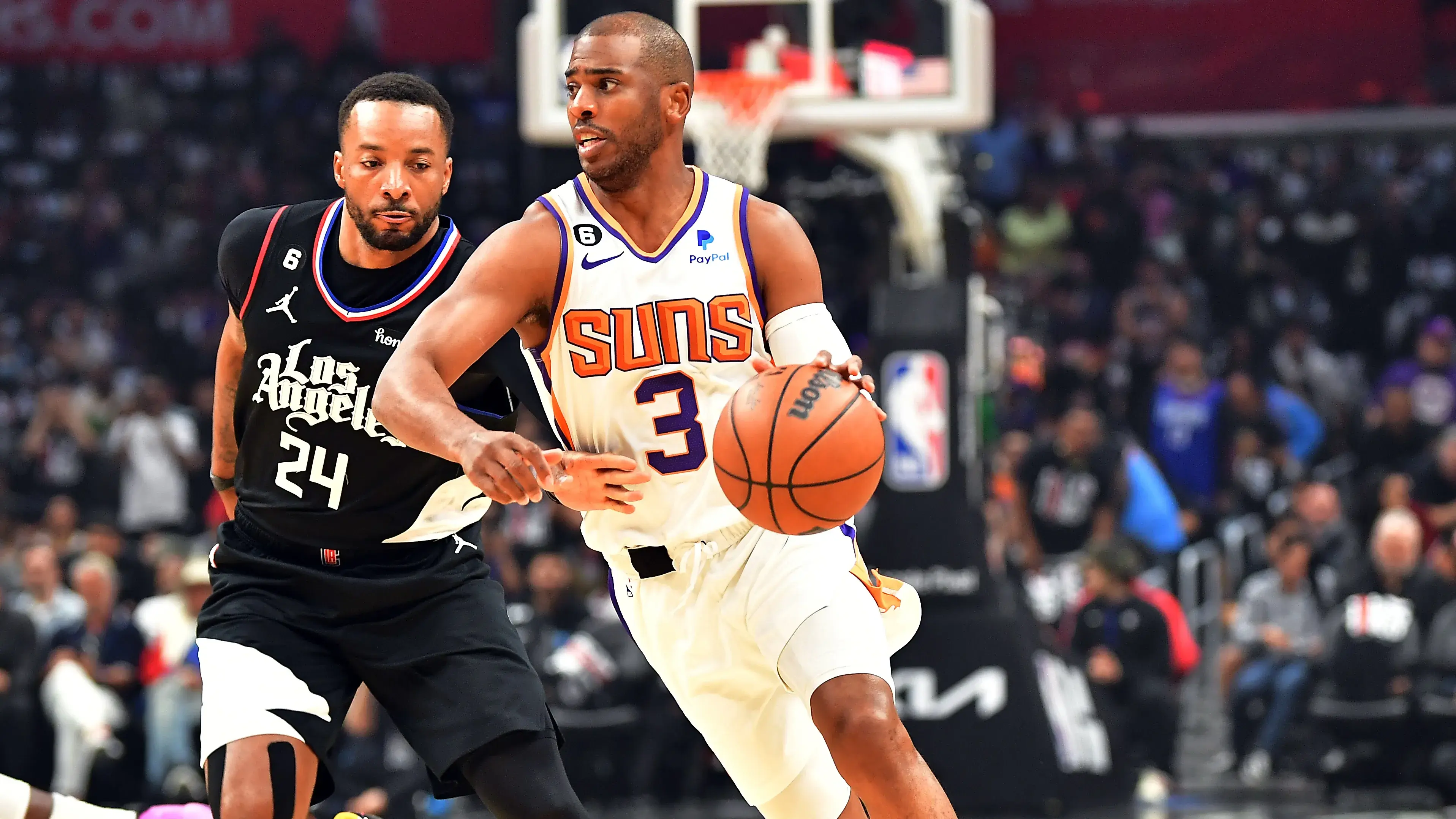 Phoenix Suns guard Chris Paul (3) moves the ball ahead of Los Angeles Clippers guard Norman Powell (24) during the first half in game four of the 2023 NBA playoffs at Crypto.com Arena / Gary A. Vasquez - USA TODAY Sports