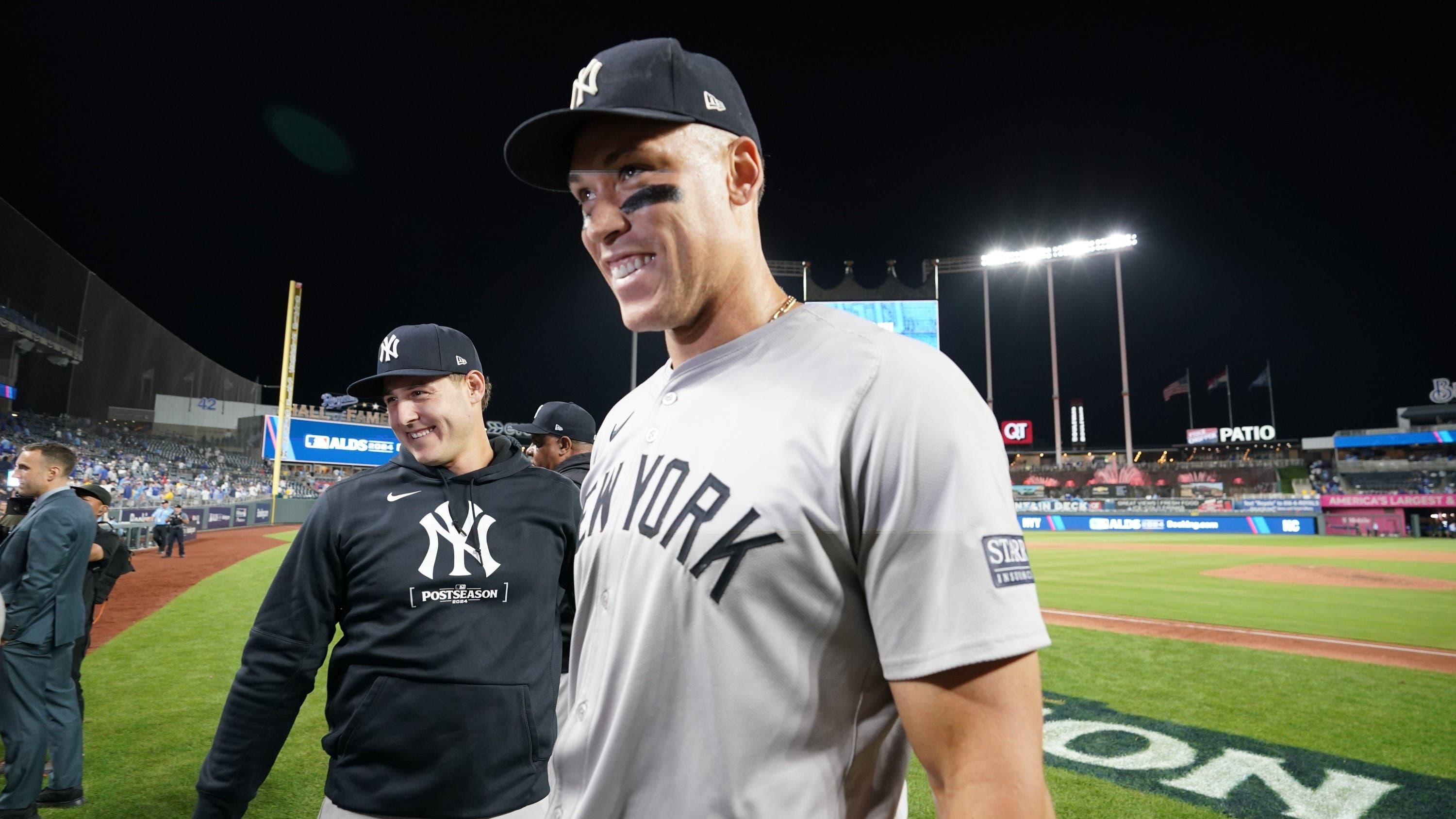 Oct 10, 2024; Kansas City, Missouri, USA; New York Yankees outfielder Aaron Judge (99) smiles while leaving the field following a win over the Kansas City Royals during game four of the ALDS for the 2024 MLB Playoffs at Kauffman Stadium.