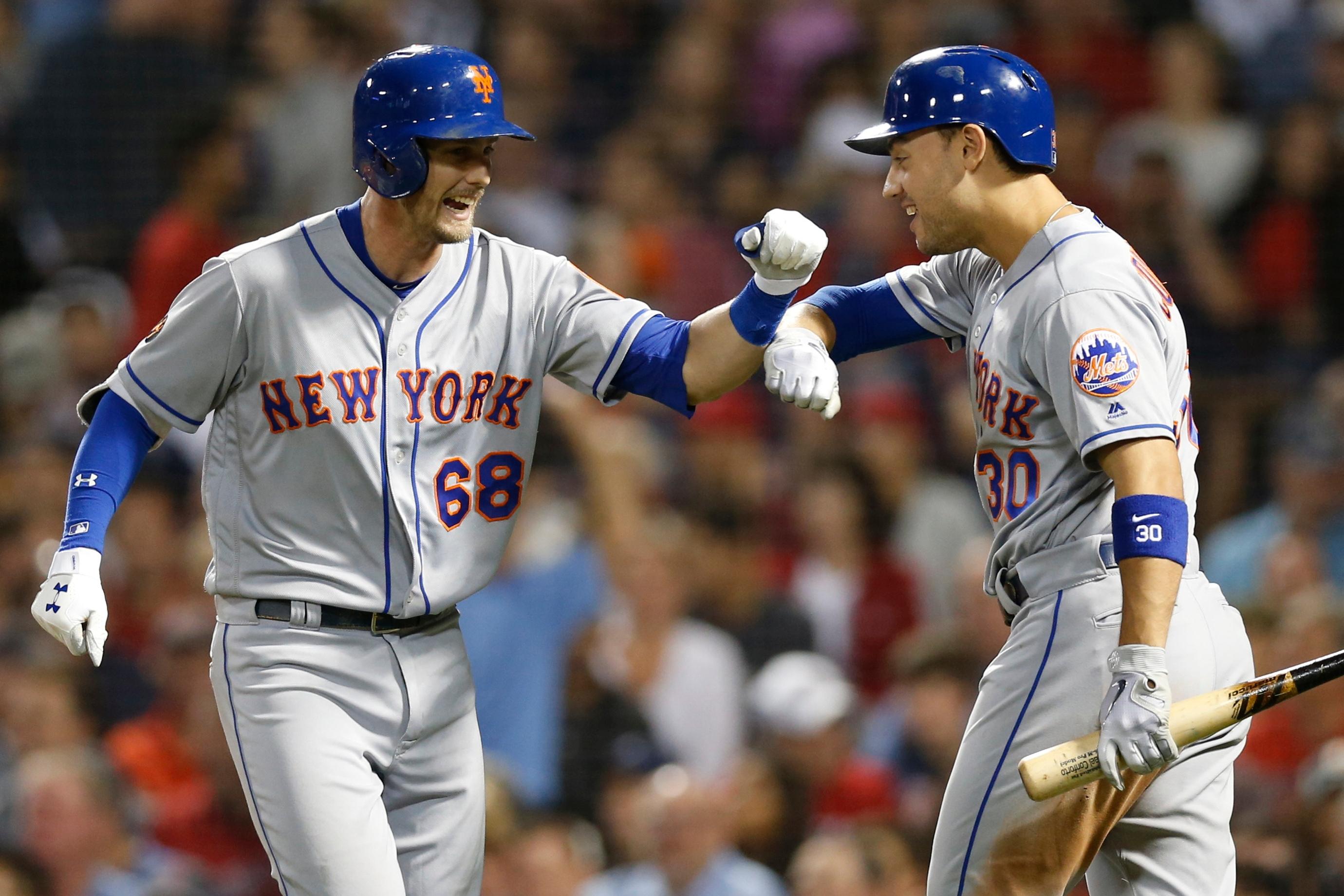 Sep 14, 2018; Boston, MA, USA; New York Mets left fielder Michael Conforto (30) congratulates second baseman Jeff McNeil (68) after hitting a solo home run during the fourth inning against the Boston Red Sox at Fenway Park. Mandatory Credit: Greg M. Cooper-USA TODAY Sports