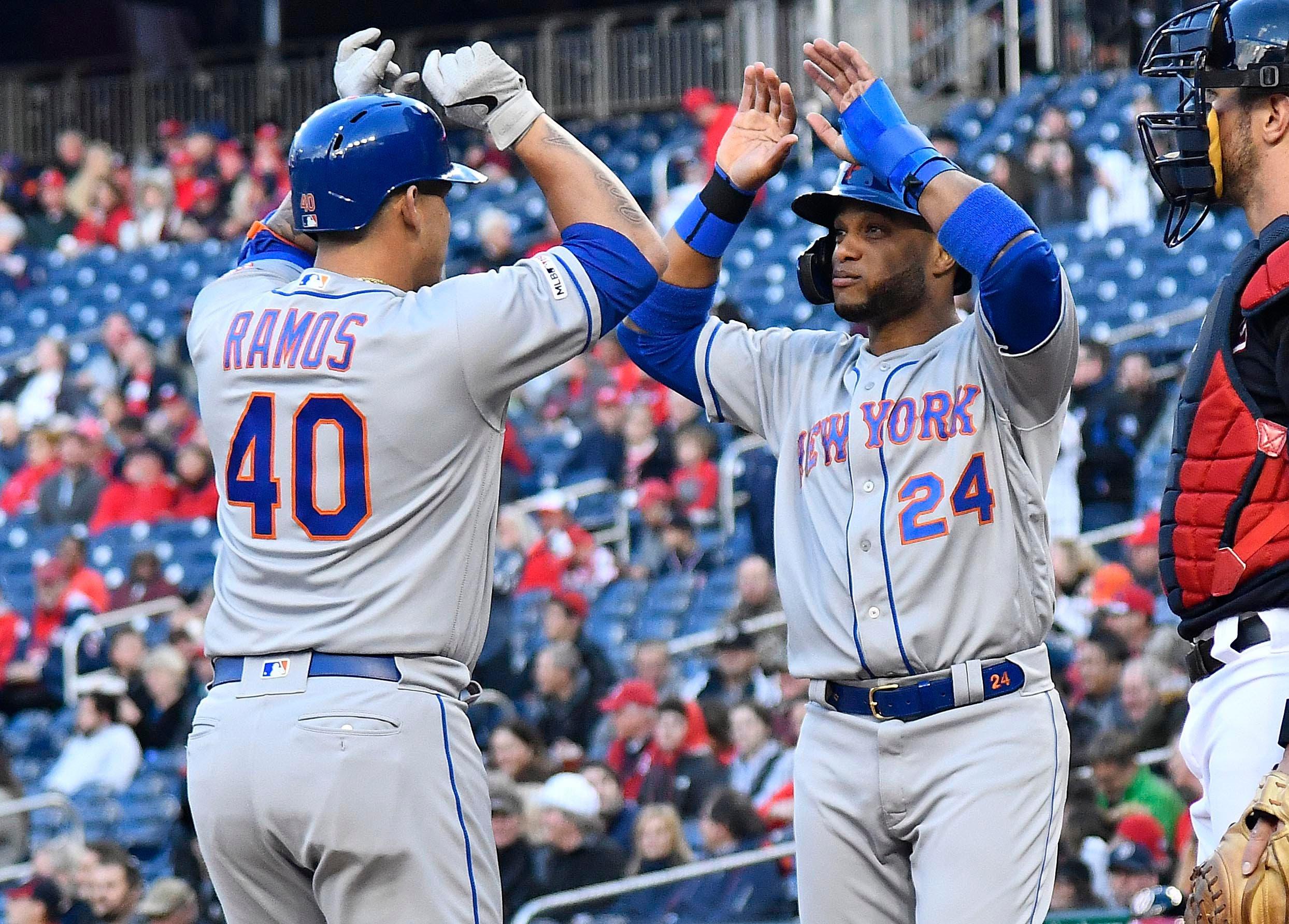 May 14, 2019; Washington, DC, USA; New York Mets catcher Wilson Ramos (40) is congratulated by second baseman Robinson Cano (24) after hitting a grand slam against the Washington Nationals during the first inning at Nationals Park. Mandatory Credit: Brad Mills-USA TODAY Sports / Brad Mills