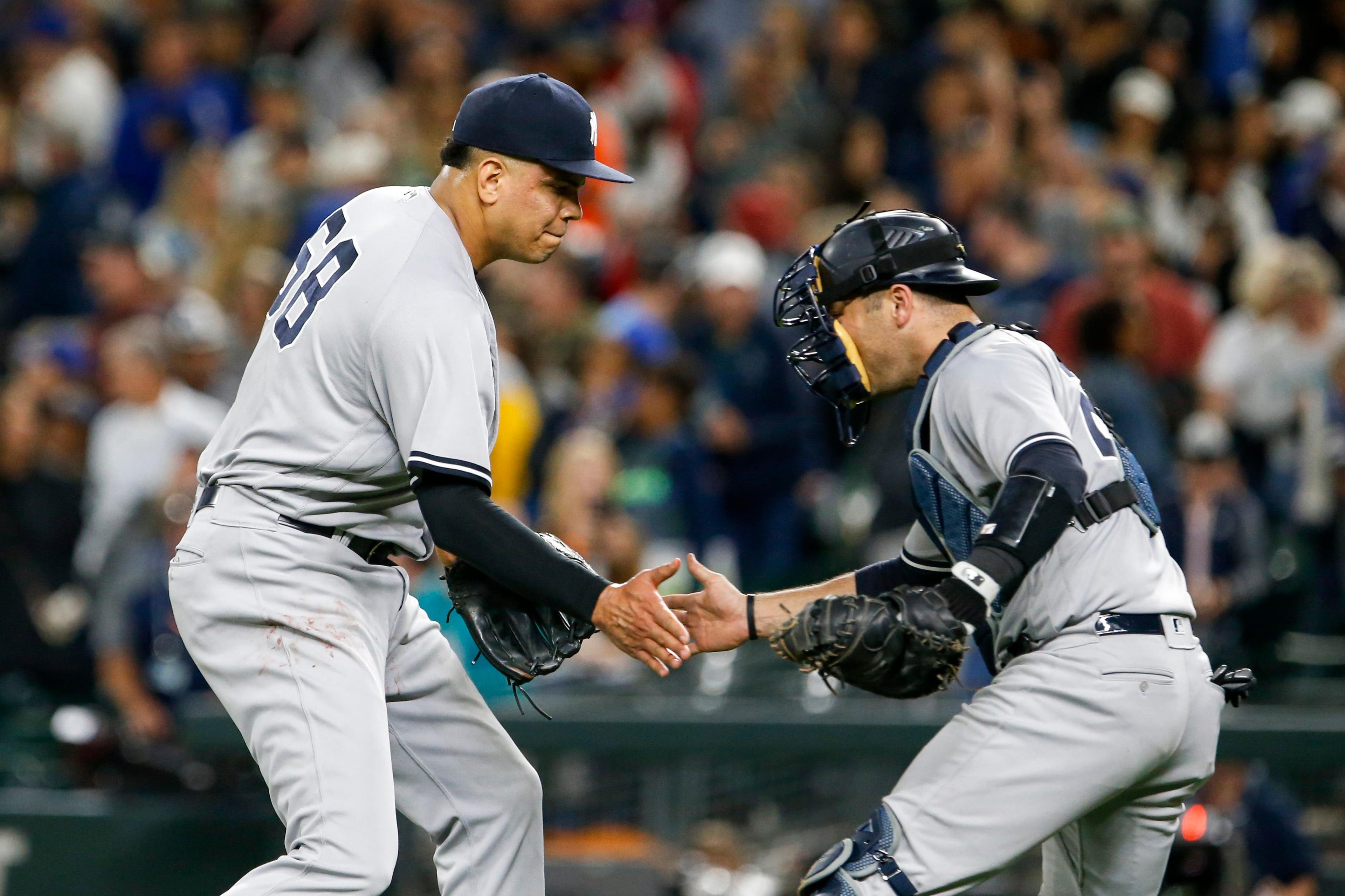 Sep 8, 2018; Seattle, WA, USA; New York Yankees relief pitcher Dellin Betances (68) celebrates with catcher Austin Romine (28) after getting the final out of a 4-2 victory against the Seattle Mariners at Safeco Field. Mandatory Credit: Joe Nicholson-USA TODAY Sports / Joe Nicholson