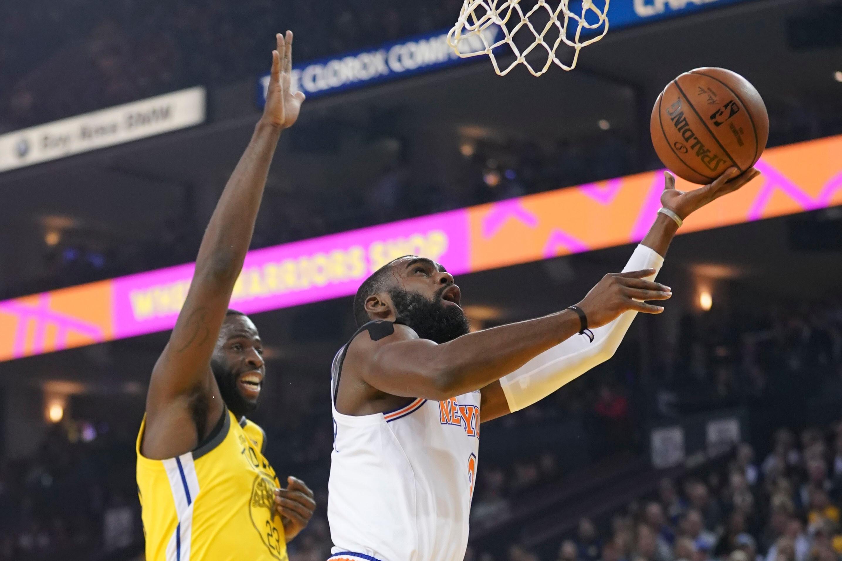 January 8, 2019; Oakland, CA, USA; New York Knicks guard Tim Hardaway Jr. (3) shoots the basketball against Golden State Warriors forward Draymond Green (23) during the first quarter at Oracle Arena. Mandatory Credit: Kyle Terada-USA TODAY Sports