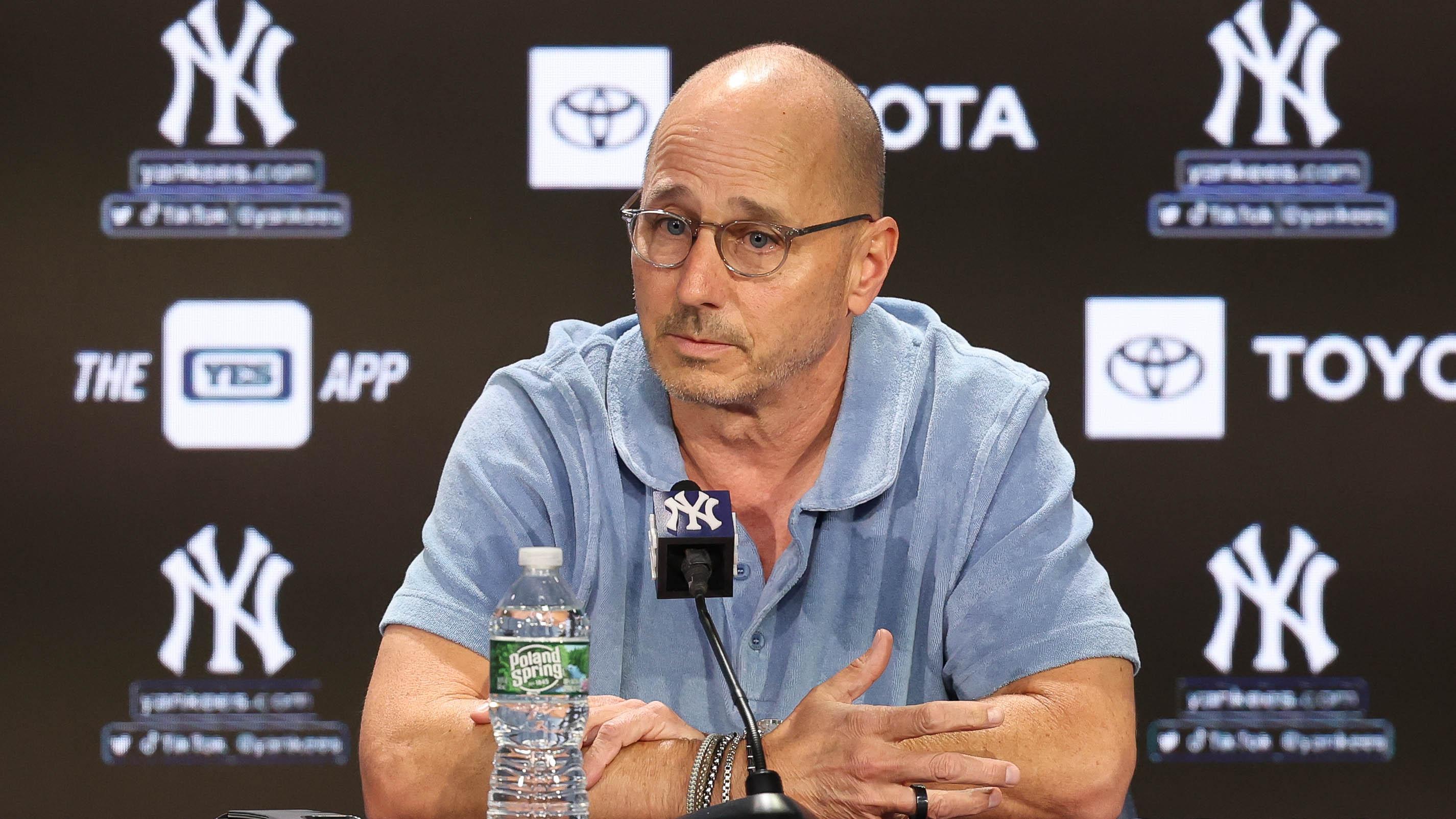  Bronx, New York, USA; New York Yankees general manager Brian Cashman talks with the media before the game between the Yankees and the Washington Nationals at Yankee Stadium. 