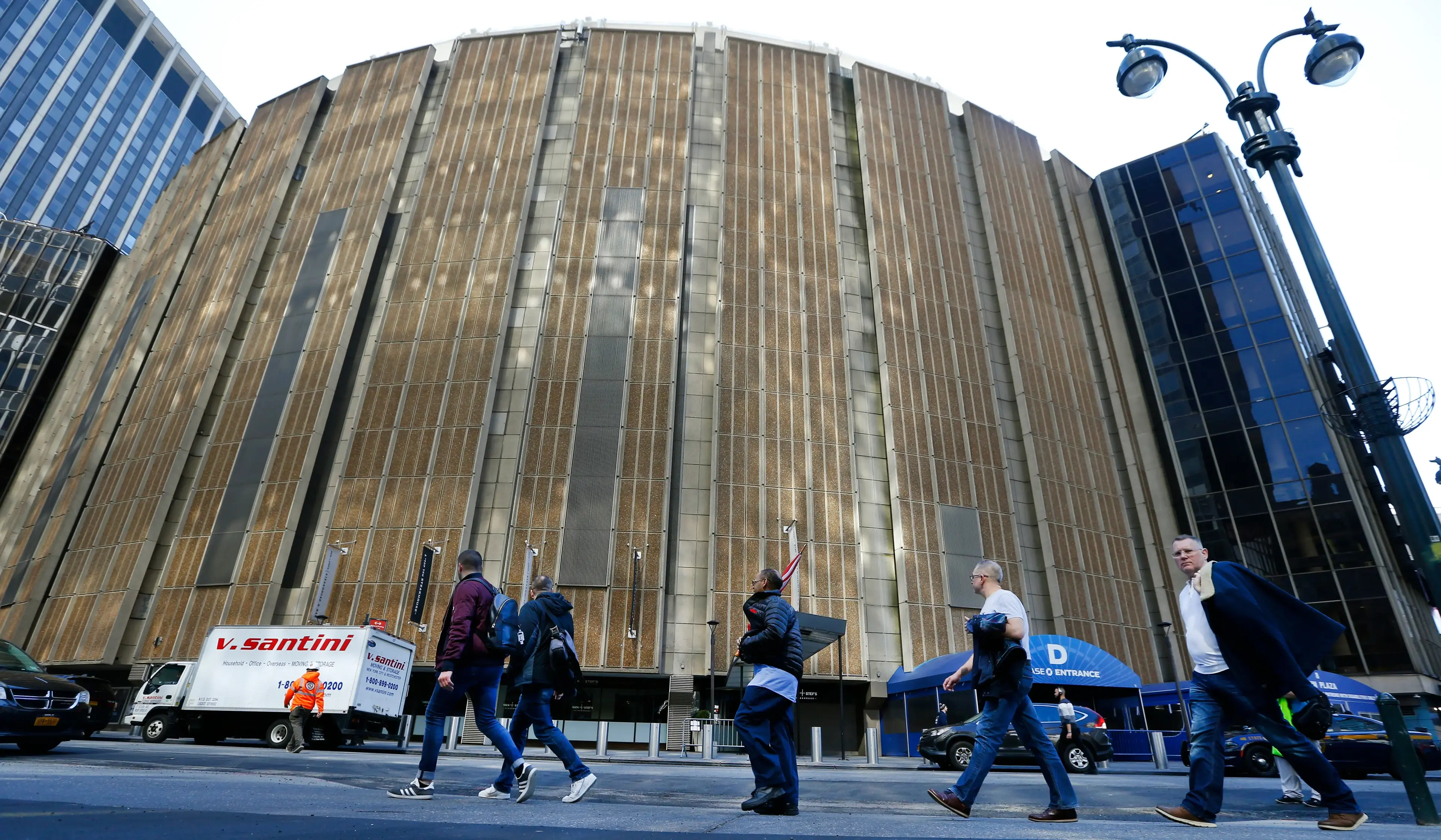 Mar 12, 2020; New York, New York, USA; The exterior of Madison Square Garden is seen as pedestrians walk by. The Big East mens basketball tournament has been cancelled along with the NCAA Division I mens and womens 2020 basketball tournaments as well as all remaining winter and spring NCAA championships due to concerns over the Covid 19 coronavirus. Mandatory Credit: Noah K. Murray-USA TODAY Sports / Noah K. Murray-USA TODAY Sports