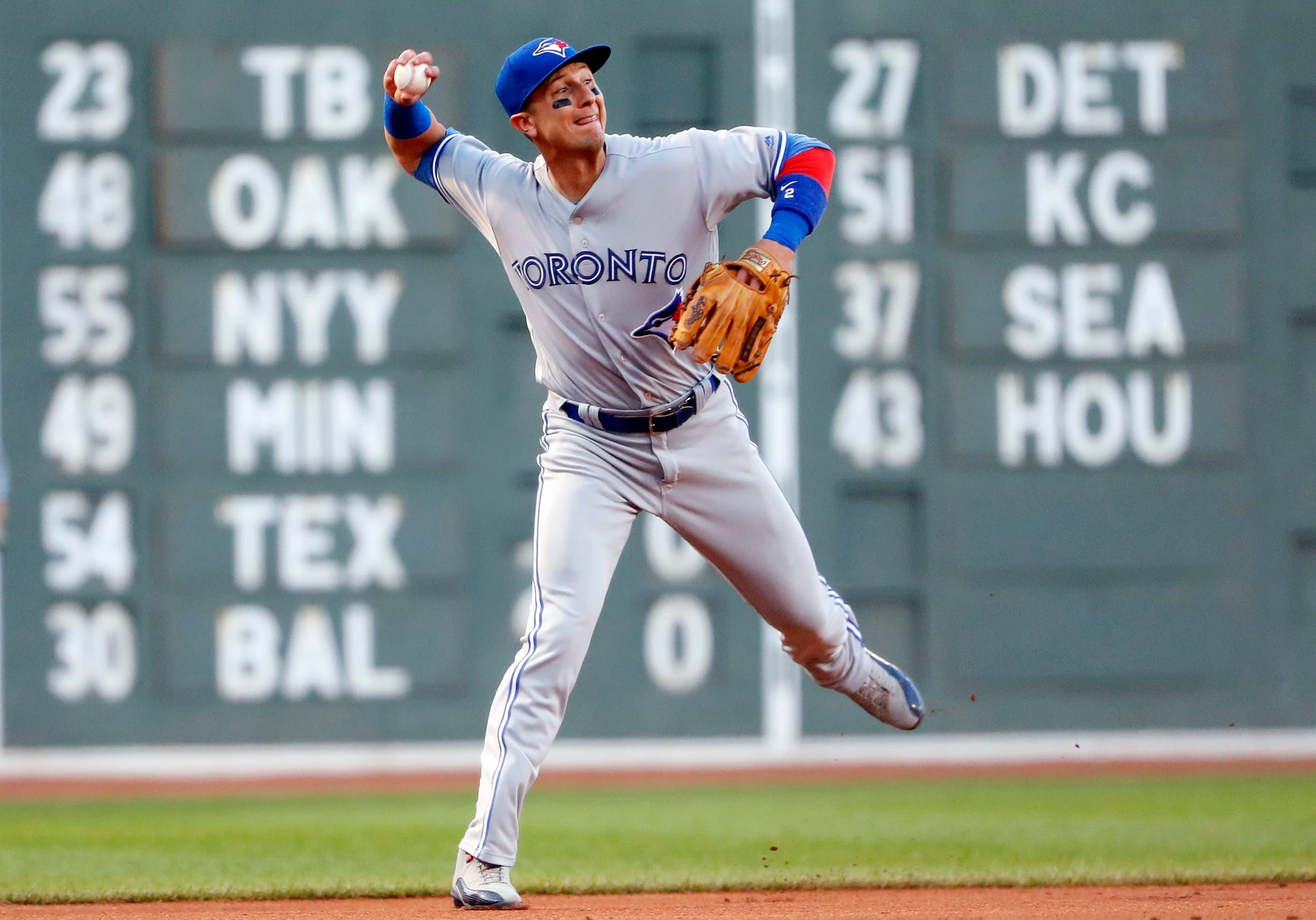 Toronto Blue Jays shortstop Troy Tulowitzki throws out Boston Red Sox right fielder Mookie Betts during the first inning at Fenway Park. / Winslow Townson/USA TODAY Sports