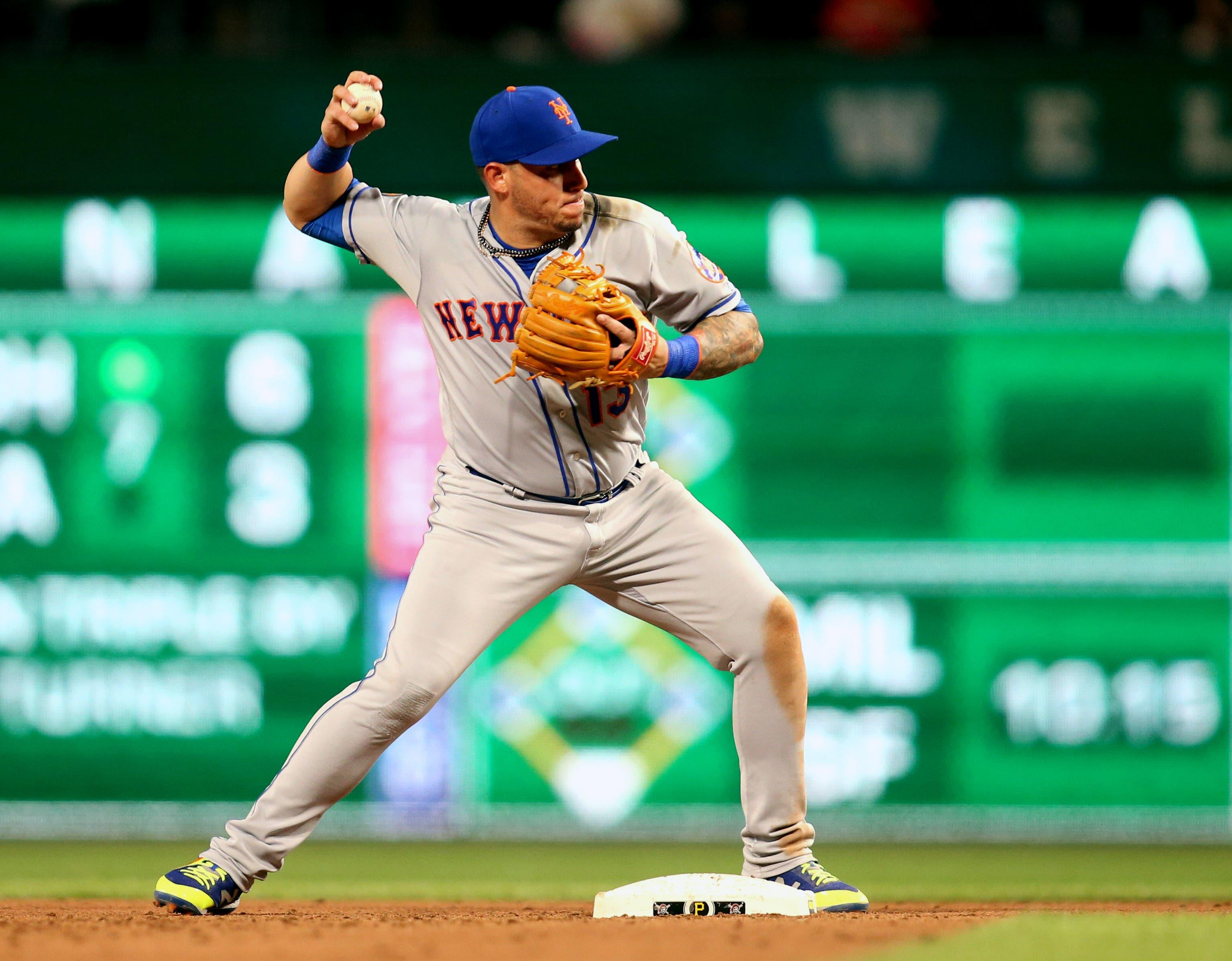 New York Mets second baseman Asdrubal Cabrera throws to first base to complete a double play against the Pittsburgh Pirates during the seventh inning at PNC Park. / Charles LeClaire/USA TODAY Sports