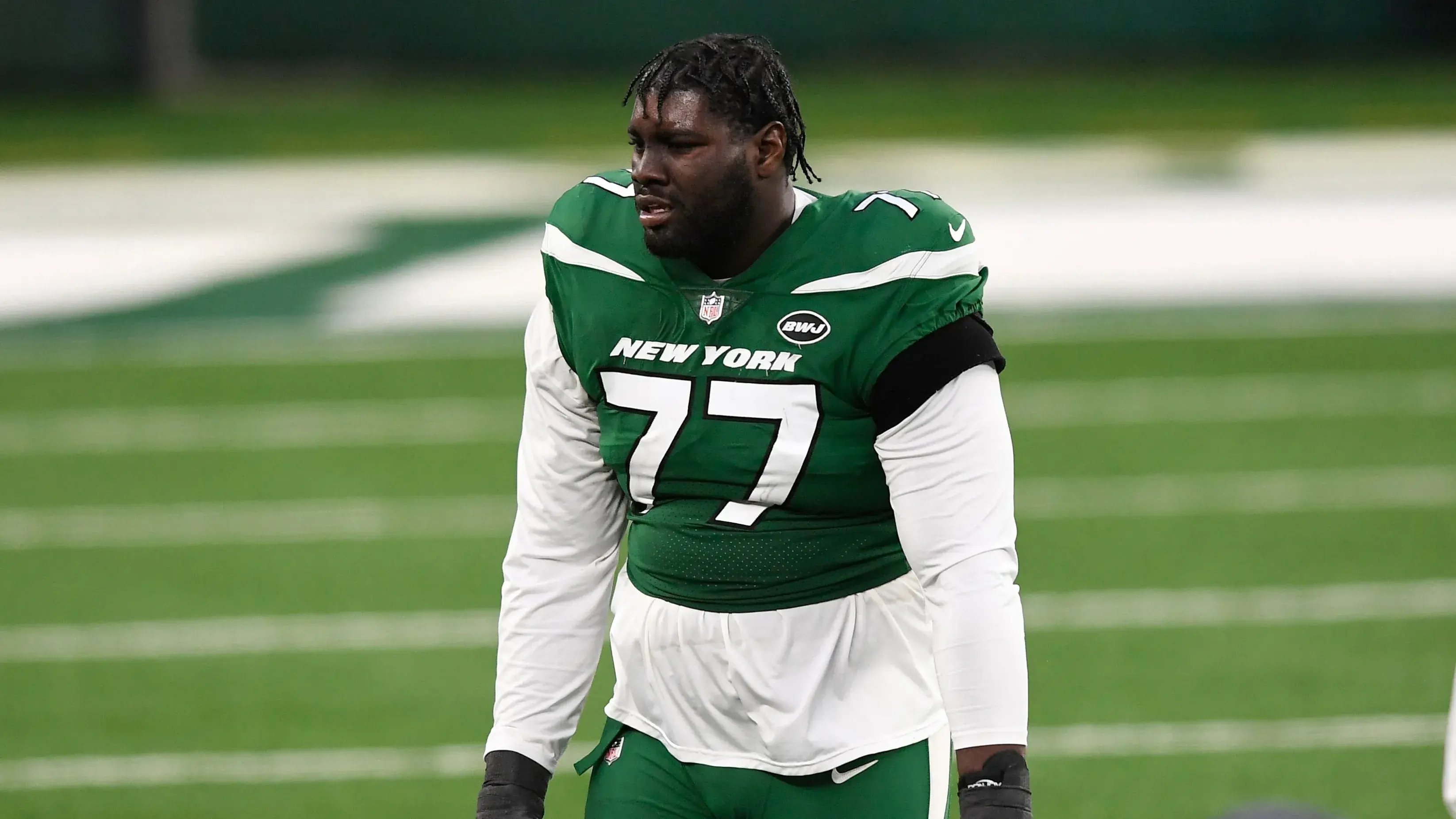 New York Jets tackle Mekhi Becton (77) reacts after losing the game late in the fourth quarter to the Las Vegas Raiders. The Jets lose to the Raiders, 31-28, at MetLife Stadium / Danielle Parhizkaran - NorthJersey.com - USA TODAY NETWORK