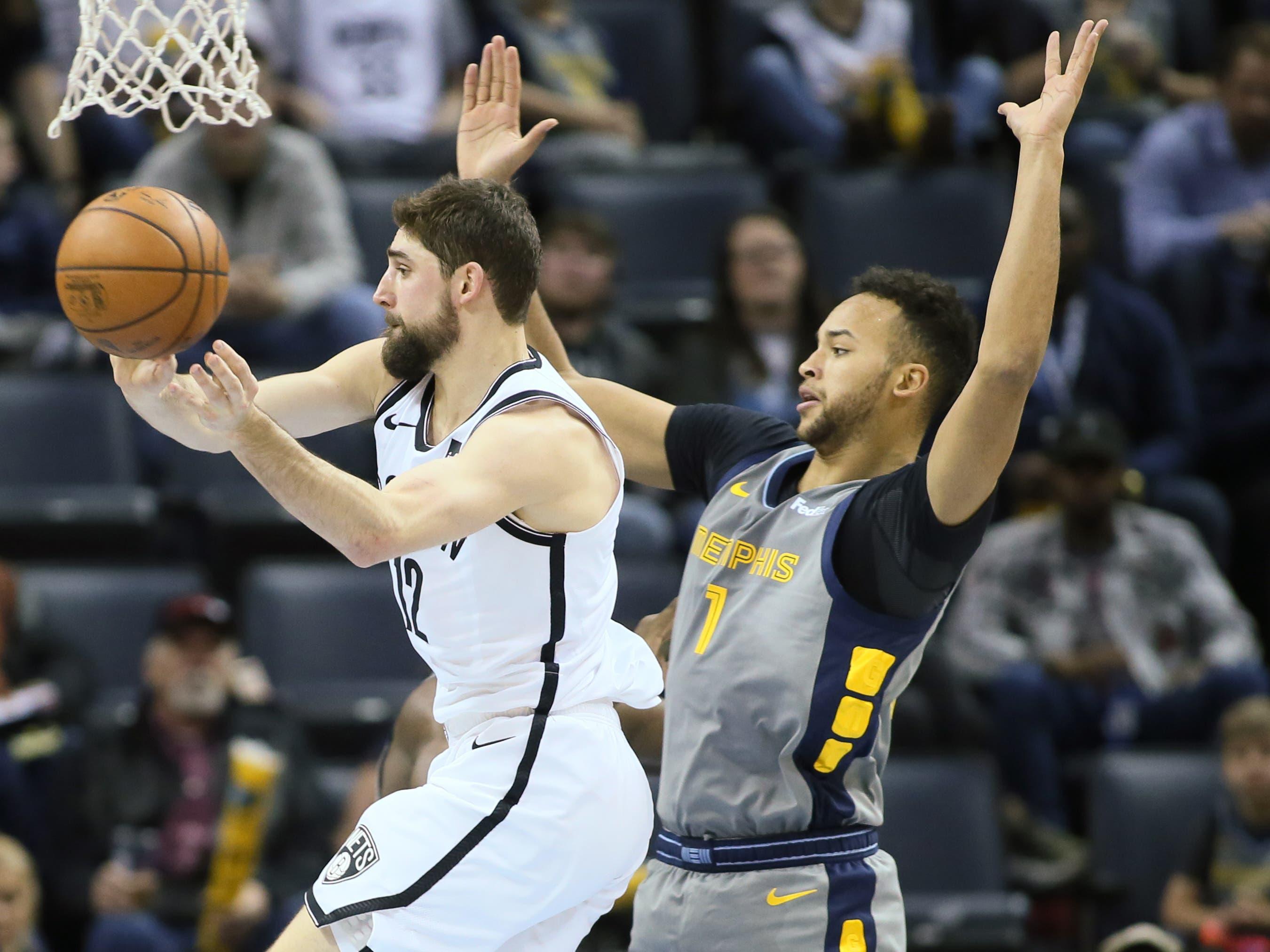 Jan 4, 2019; Memphis, TN, USA; Brooklyn Nets guard Joe Harris (12) passes as Memphis Grizzlies forward Kyle Anderson (1) defends in the first half at FedExForum. Mandatory Credit: Nelson Chenault-USA TODAY Sports / Nelson Chenault