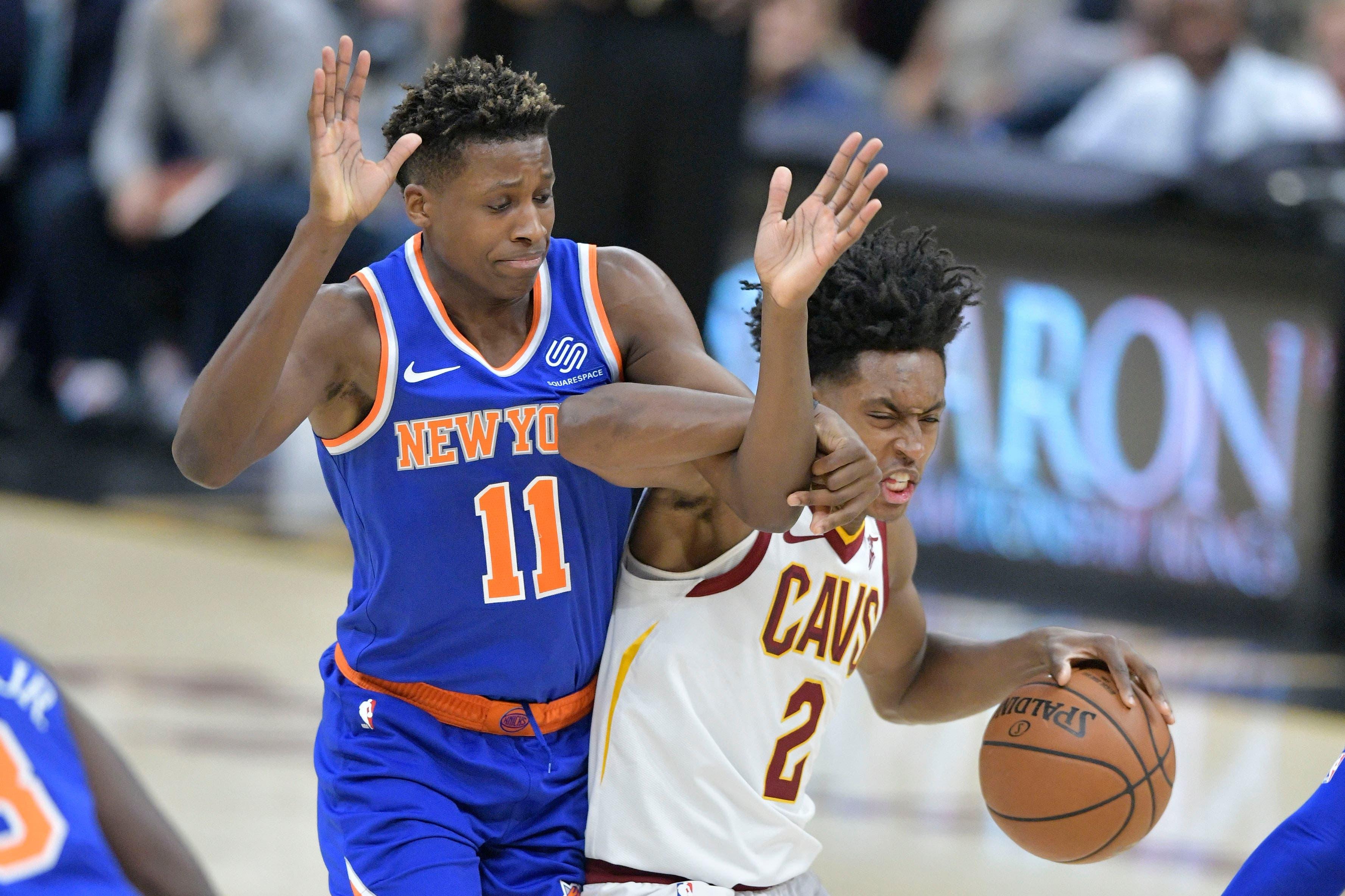 Dec 12, 2018; Cleveland, OH, USA; New York Knicks guard Frank Ntilikina (11) defends Cleveland Cavaliers guard Collin Sexton (2) in the fourth quarter at Quicken Loans Arena. Mandatory Credit: David Richard-USA TODAY Sports / David Richard