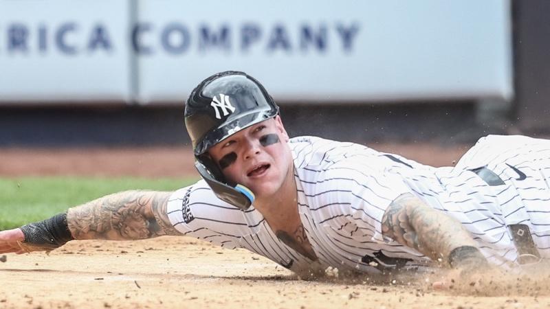 New York Yankees left fielder Alex Verdugo (24) reacts after getting tagged out at home plate in the sixth inning against the Cincinnati Reds at Yankee Stadium.