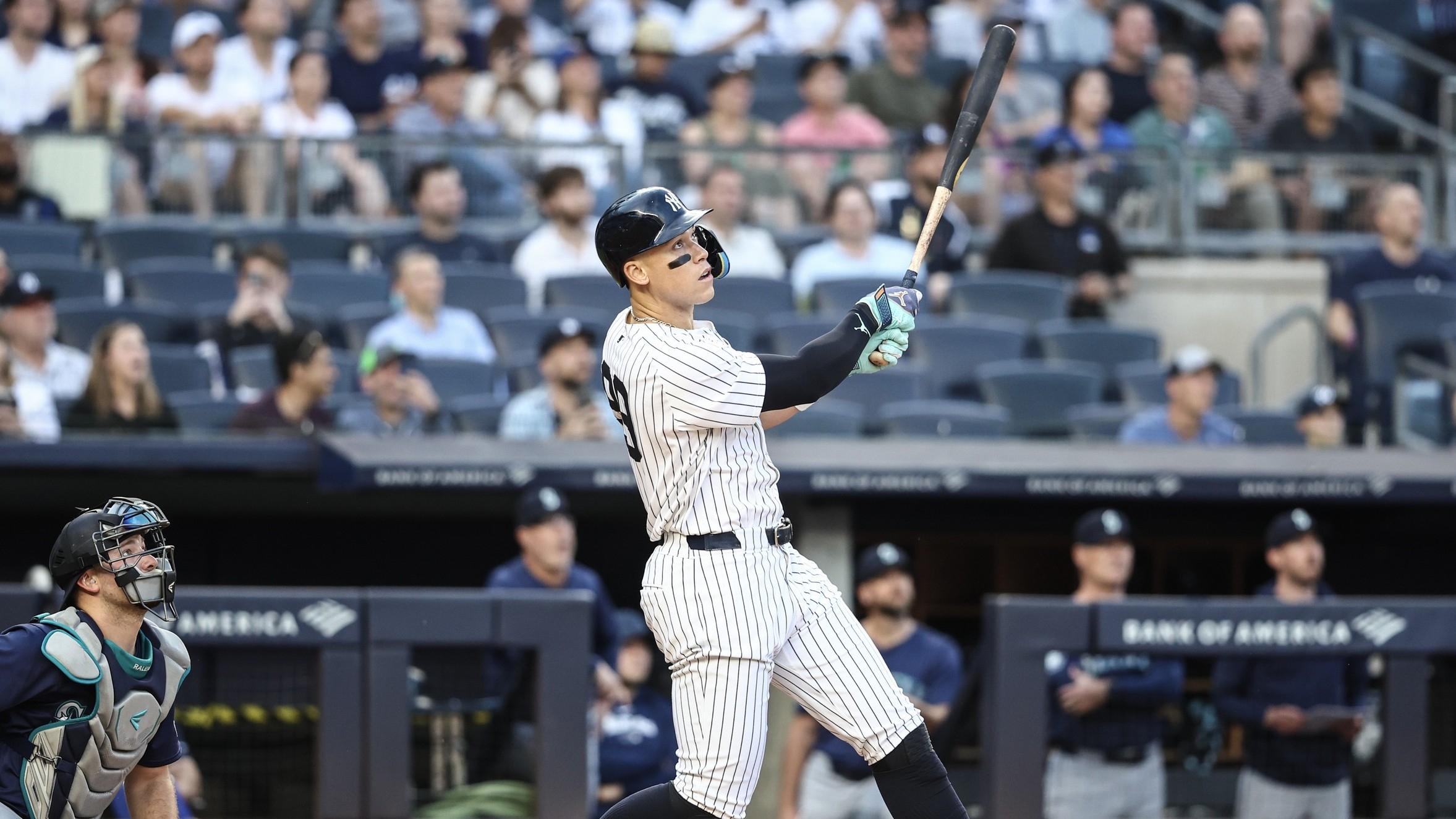 New York Yankees center fielder Aaron Judge (99) hits a two run home run in the first inning against the Seattle Mariners at Yankee Stadium. / Wendell Cruz-USA TODAY Sports