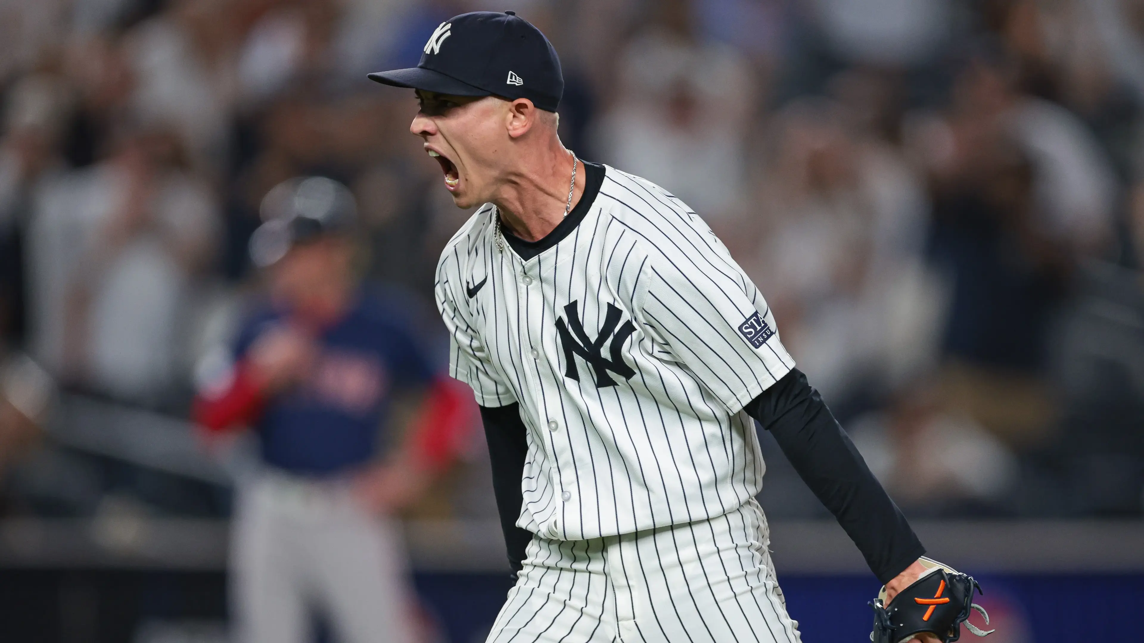 New York Yankees relief pitcher Luke Weaver (30) reacts after closing the game against the Boston Red Sox at Yankee Stadium. / Vincent Carchietta - Imagn Images