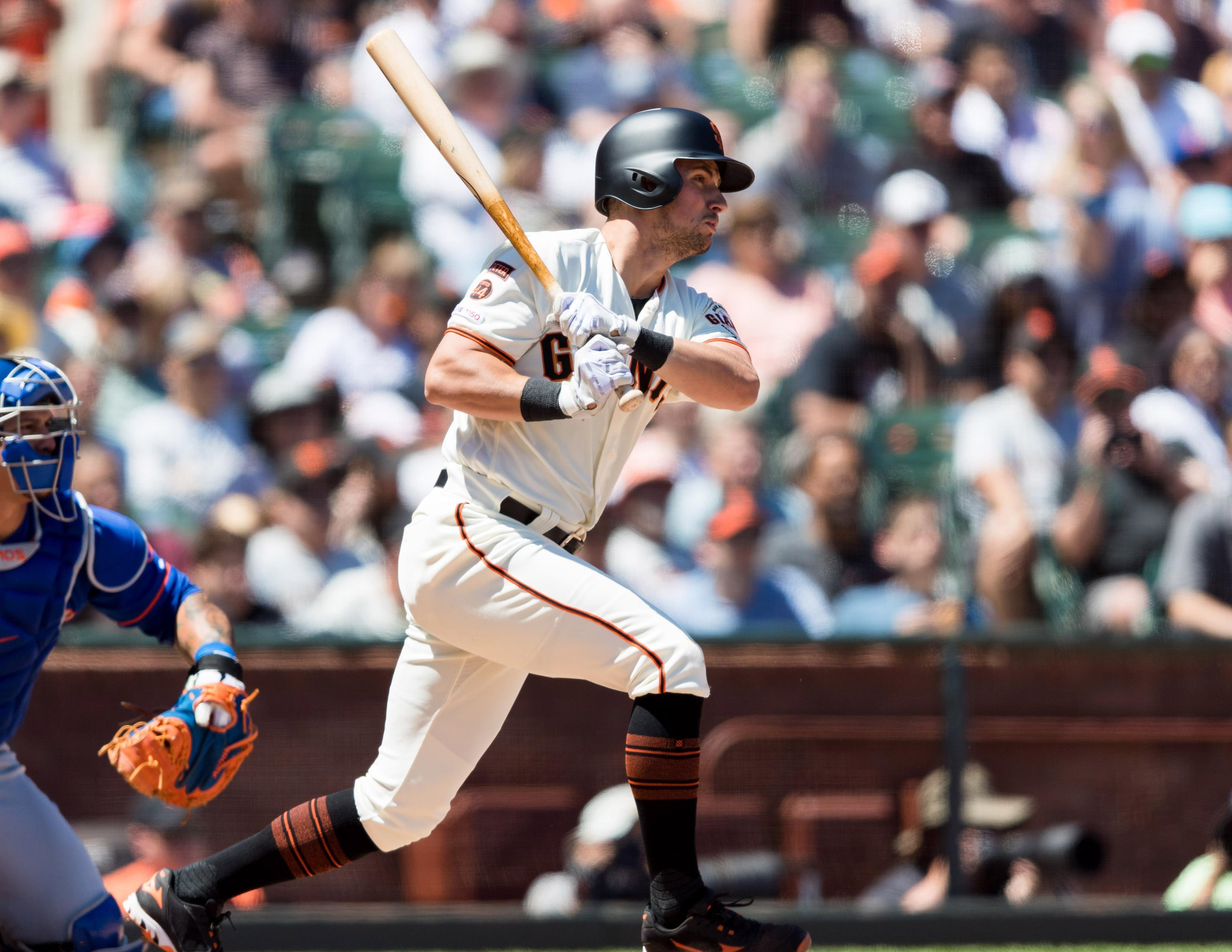 Jul 20, 2019; San Francisco, CA, USA; San Francisco Giants second baseman Joe Panik (12) hits an RBI single against the New York Mets in the fifth inning at Oracle Park. Mandatory Credit: John Hefti-USA TODAY Sports / John Hefti